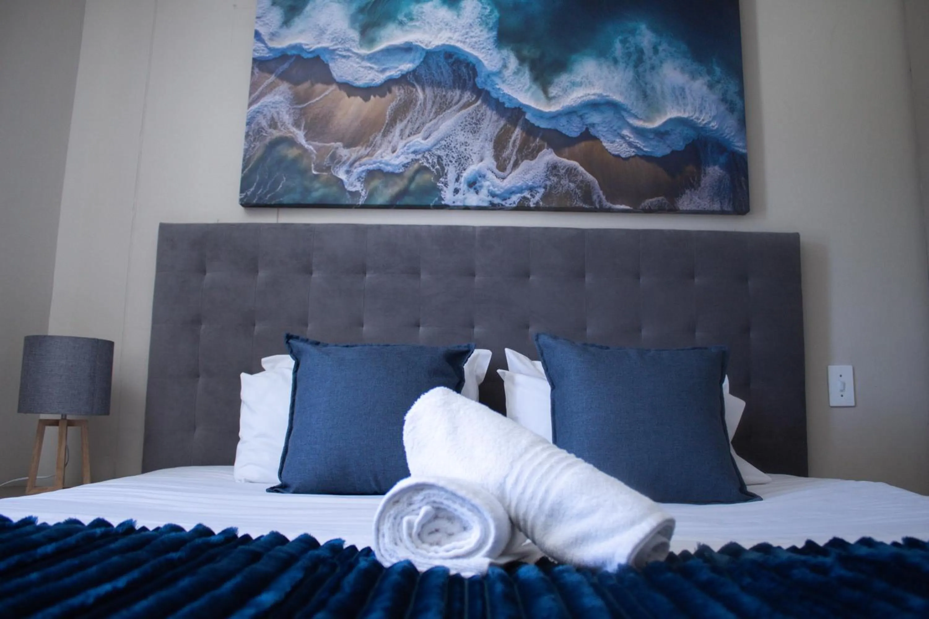 Bed in Ocean Breeze Hotel