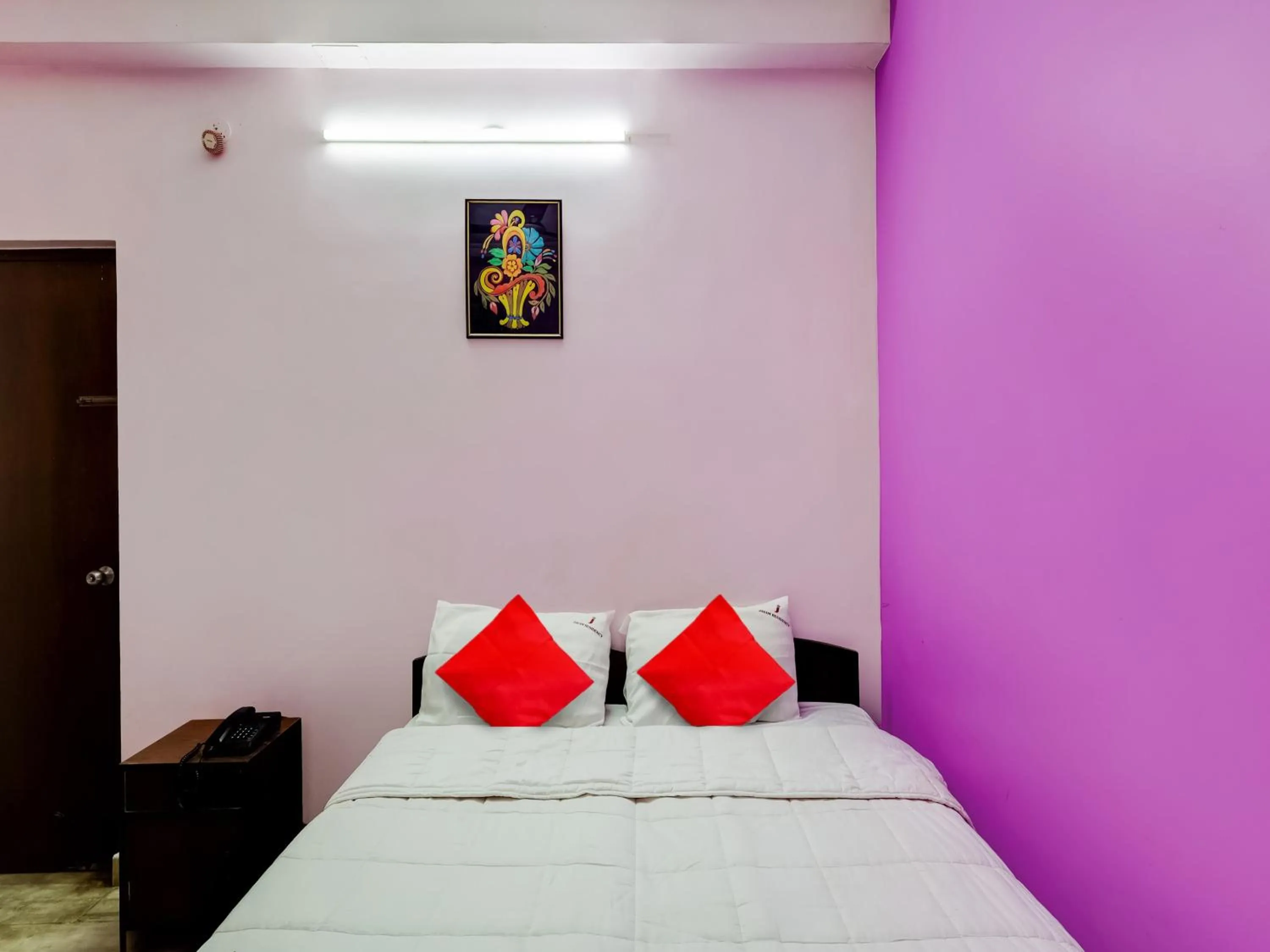 Bedroom in Hotel O Jayam Residency