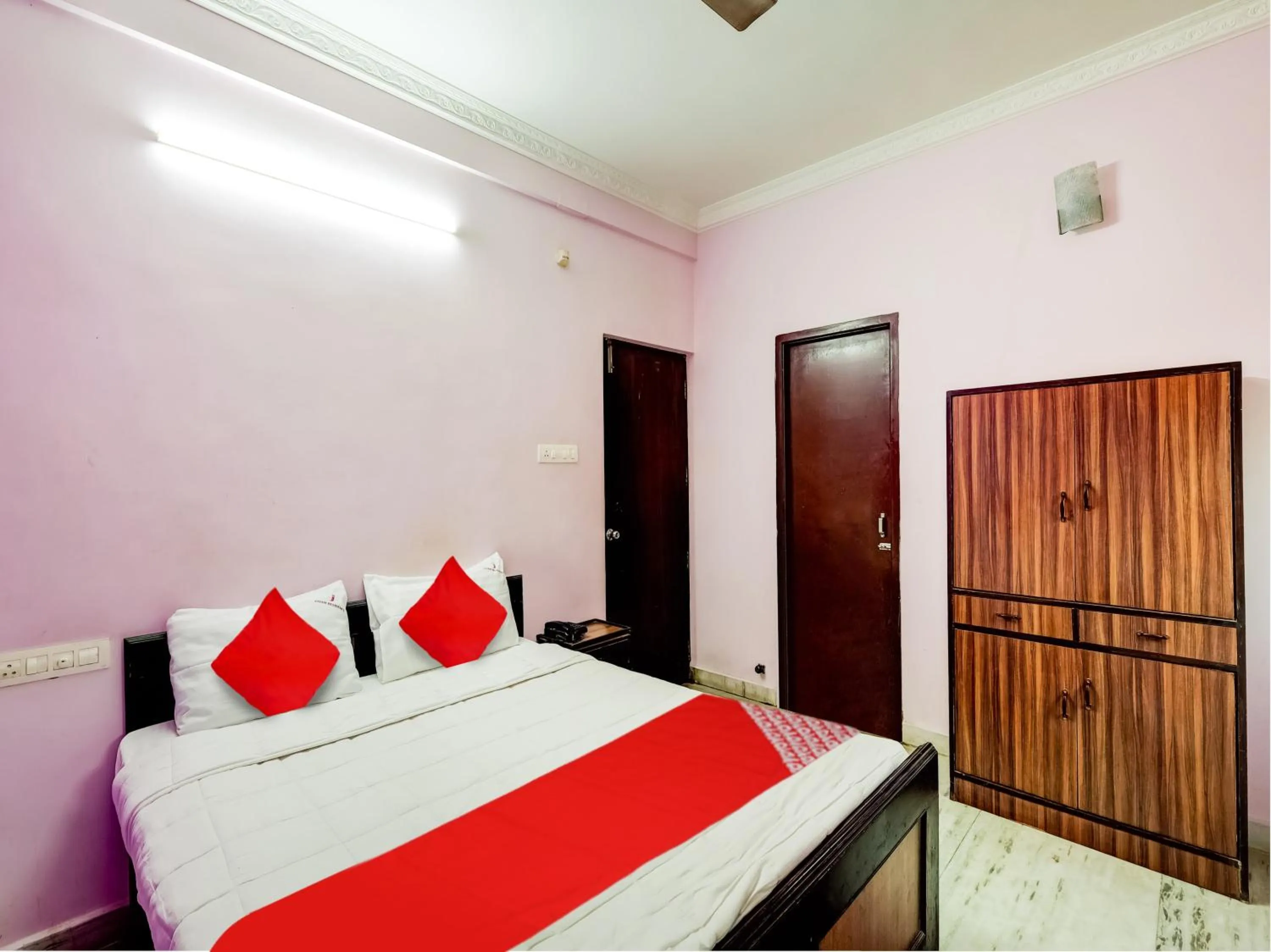 Bedroom in Hotel O Jayam Residency