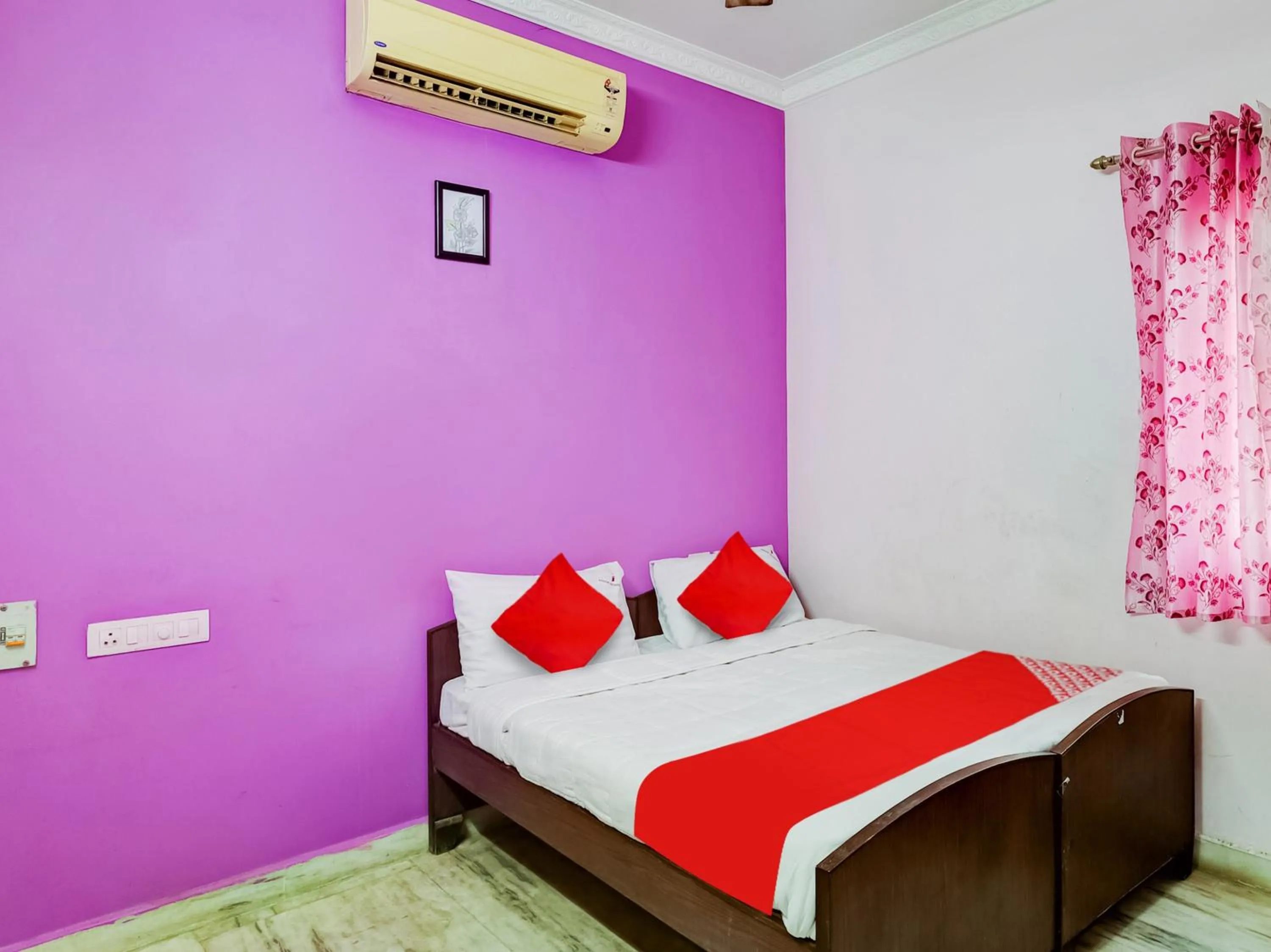 Bedroom in Hotel O Jayam Residency