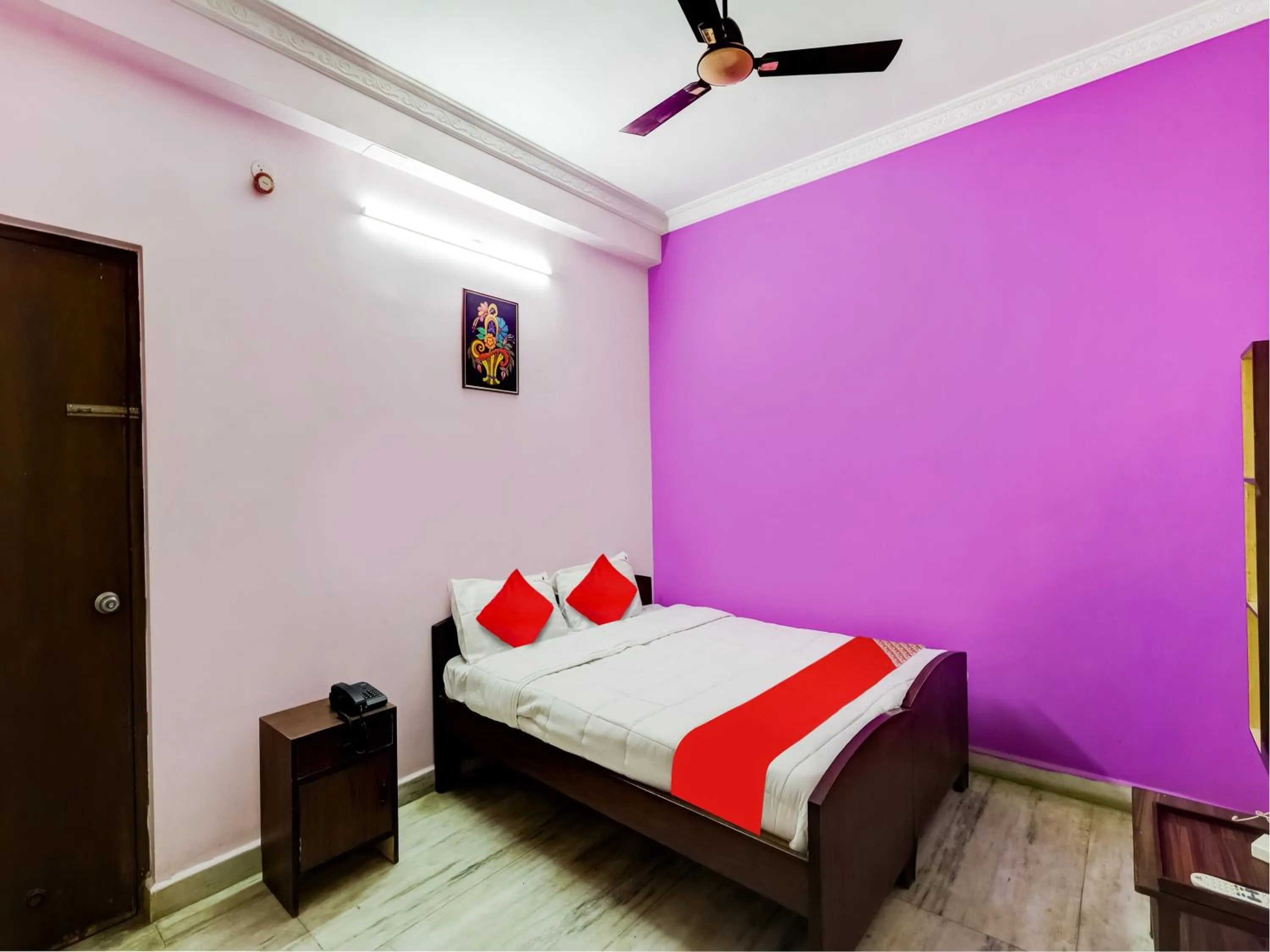 Bedroom in Hotel O Jayam Residency