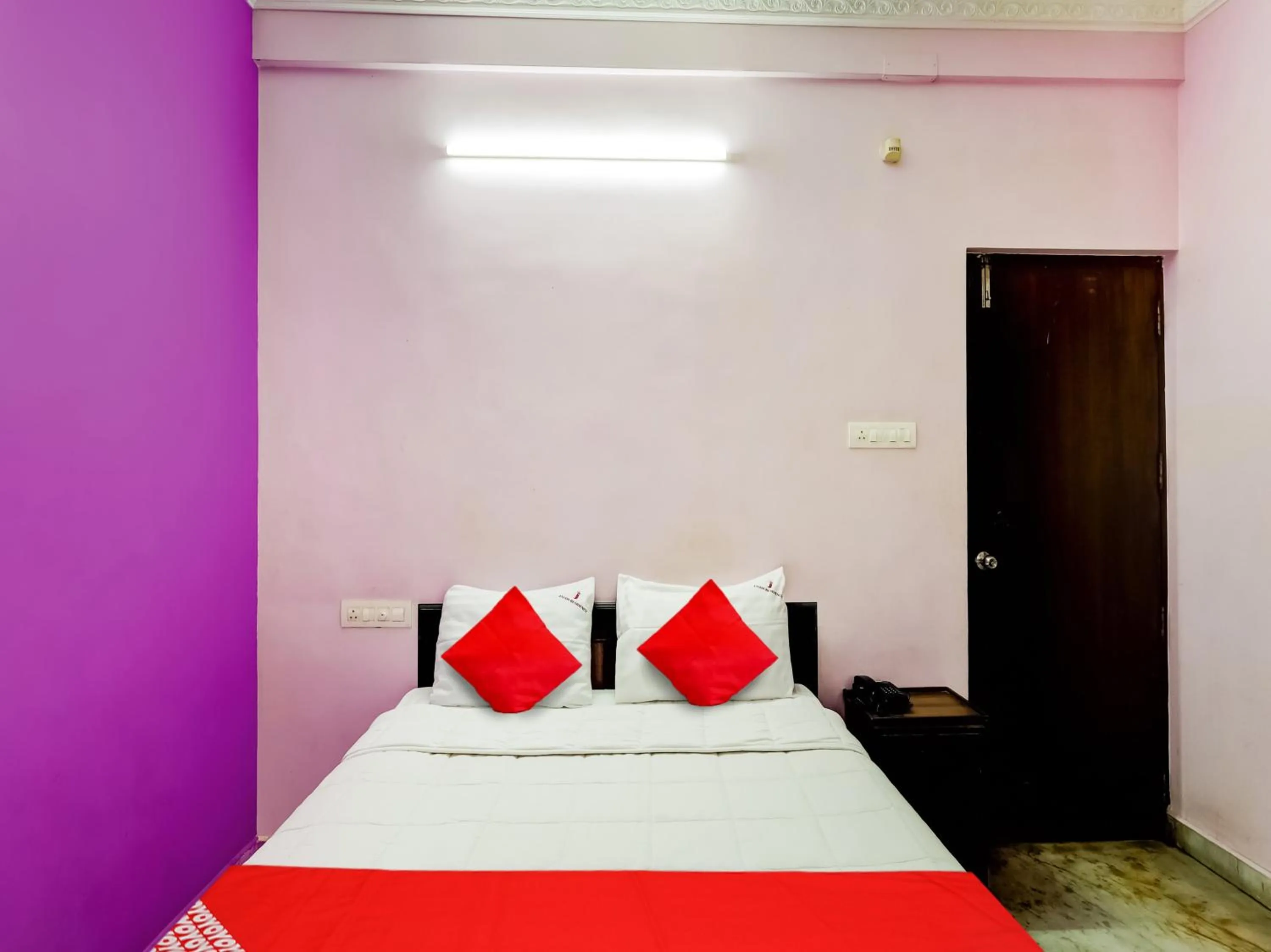 Bedroom in Hotel O Jayam Residency
