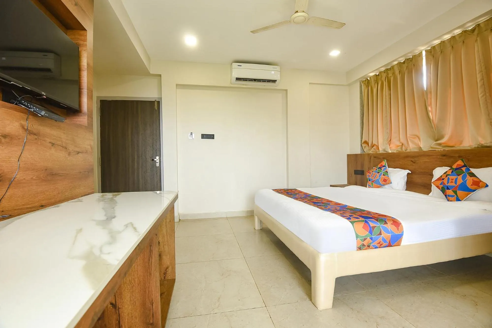 Bed in FabHotel Avasa Grand - Nr Big Daddy Casino