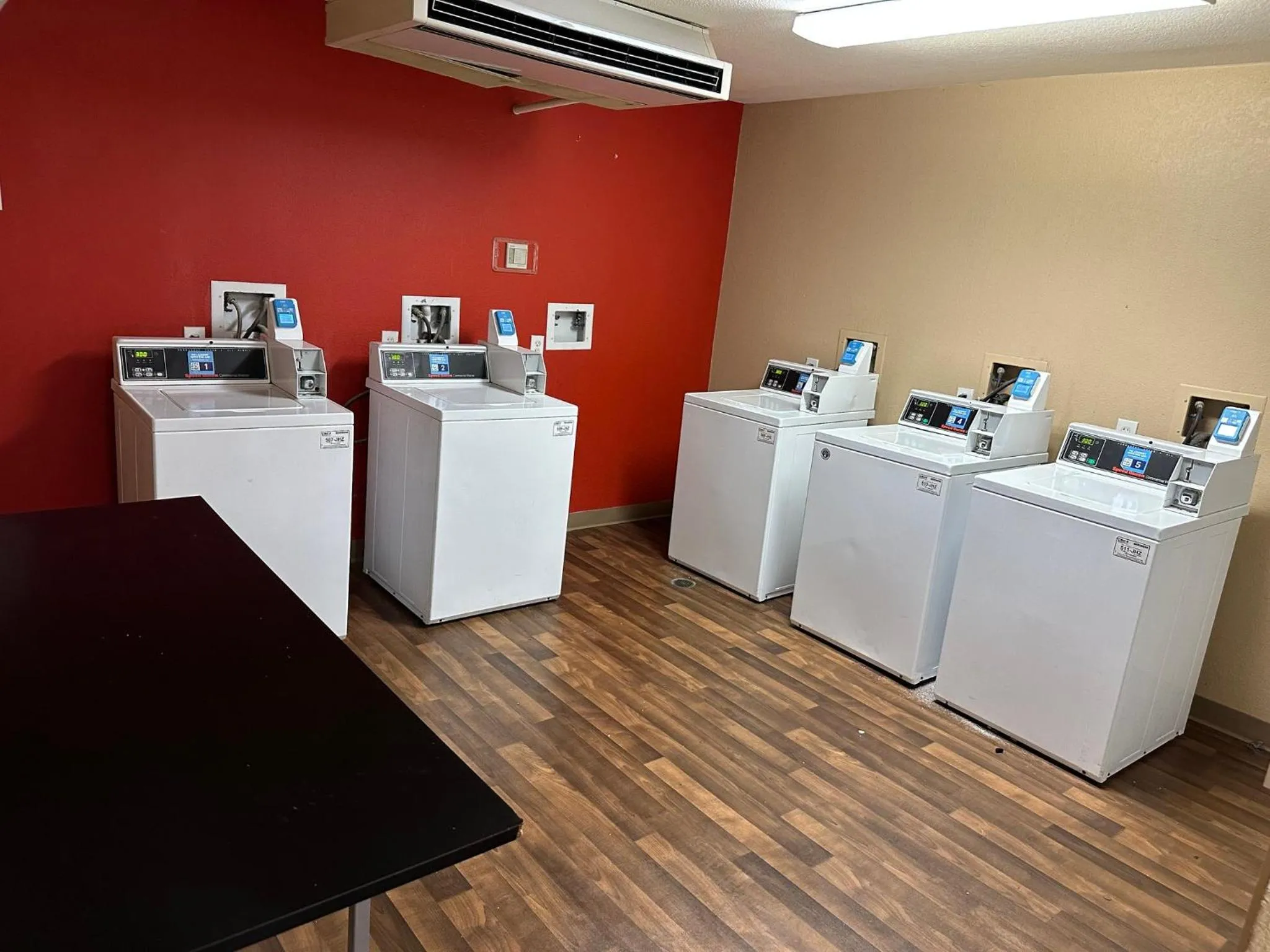 laundry in HomeTowne Studios by Red Roof Southfield