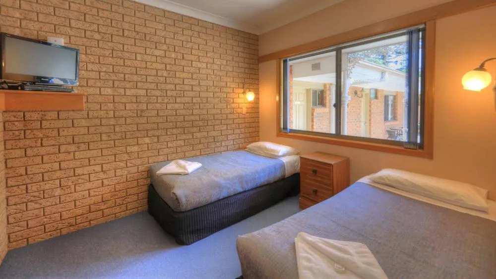 Bed in Barrass's John Bright Motor Inn