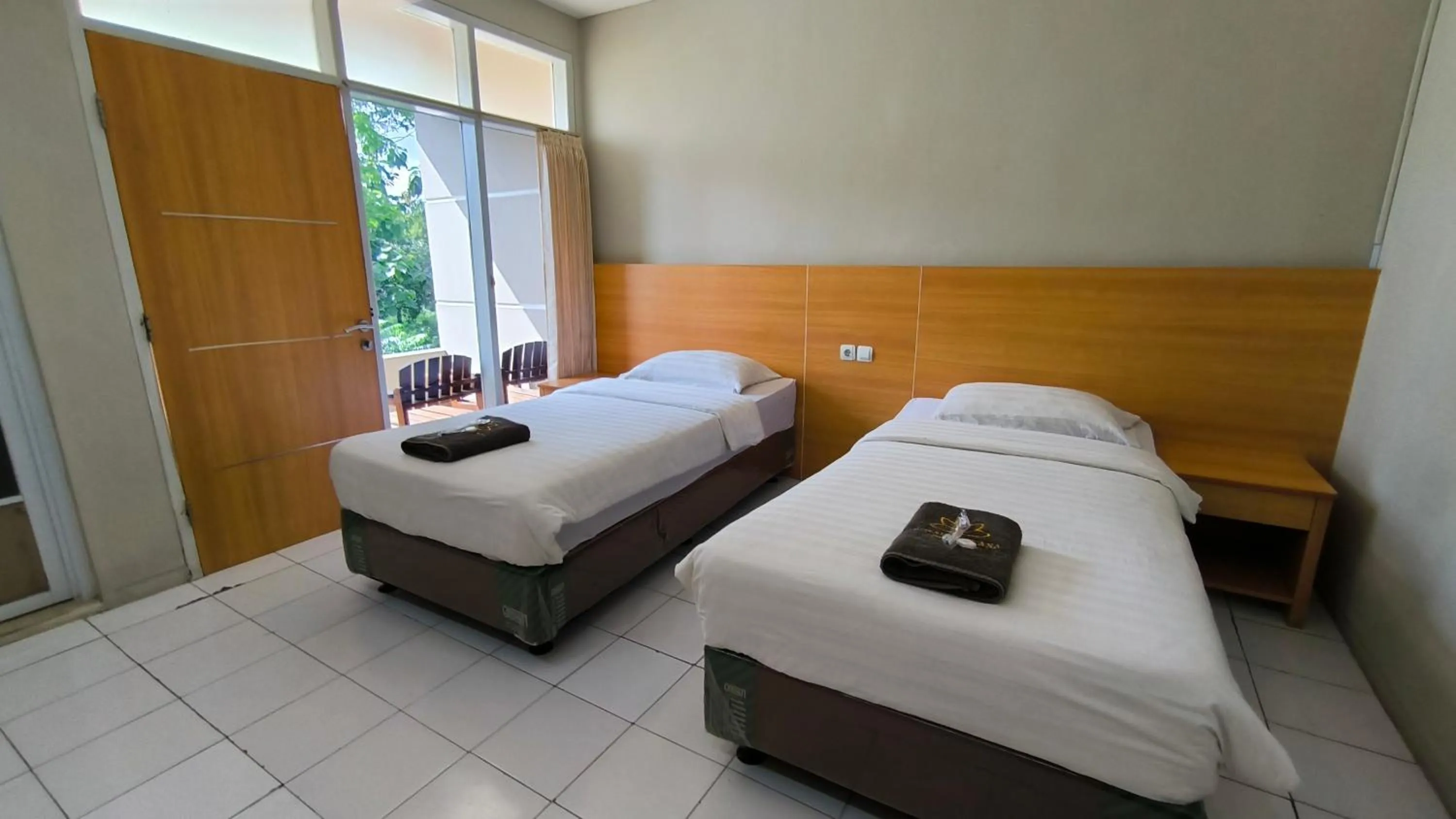 Bed in Royal Kencana Hotel powered by Cocotel