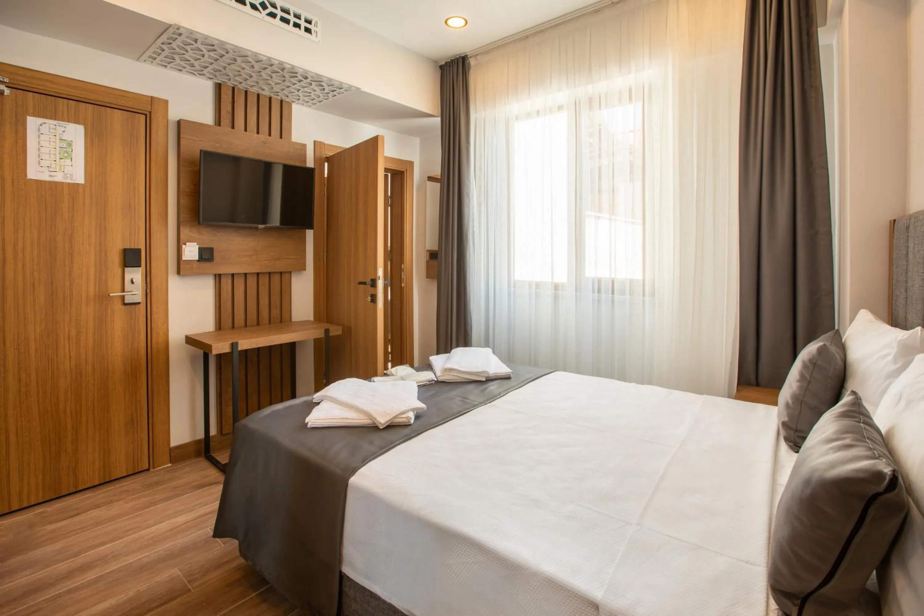 Bed in Grand Business Hotel