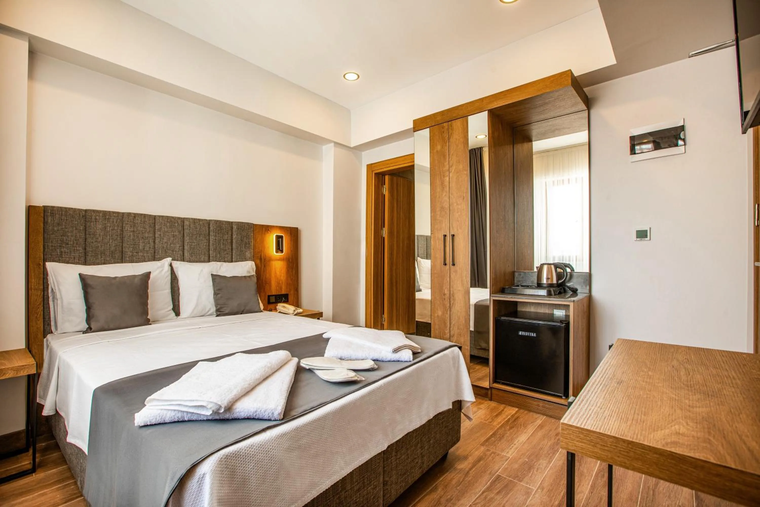 Bed in Grand Business Hotel