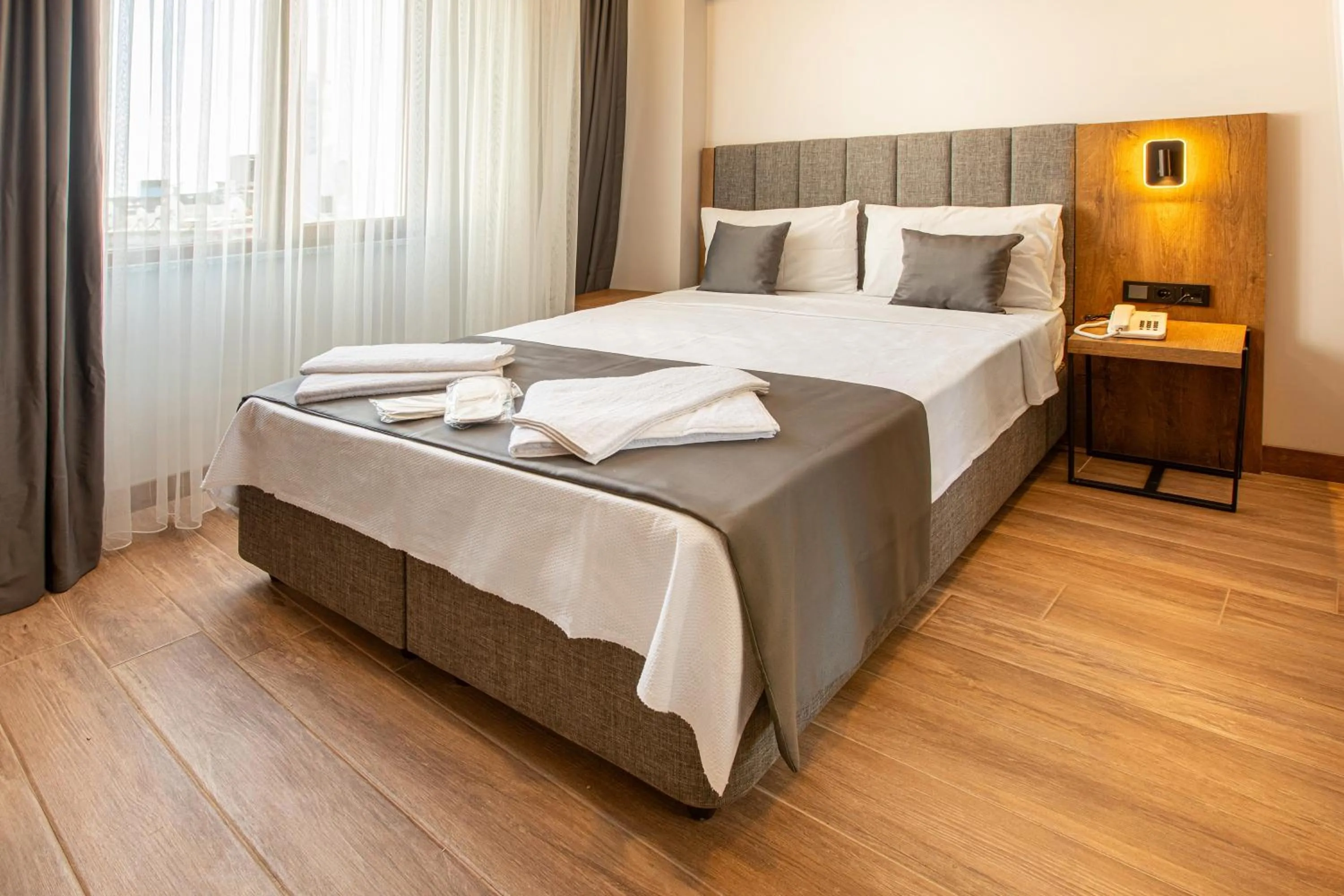 Bed in Grand Business Hotel