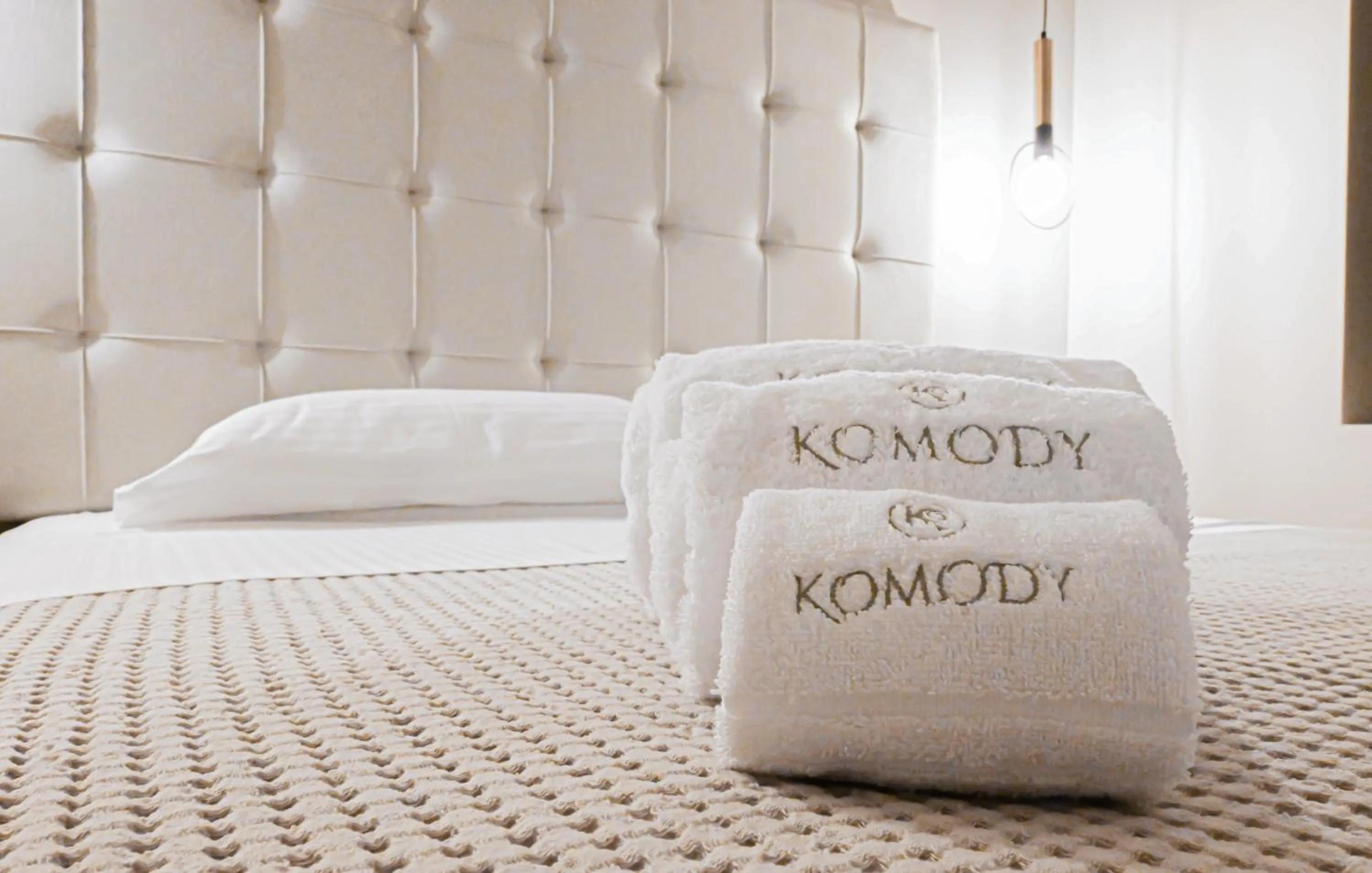 Bed in Komody Apartments