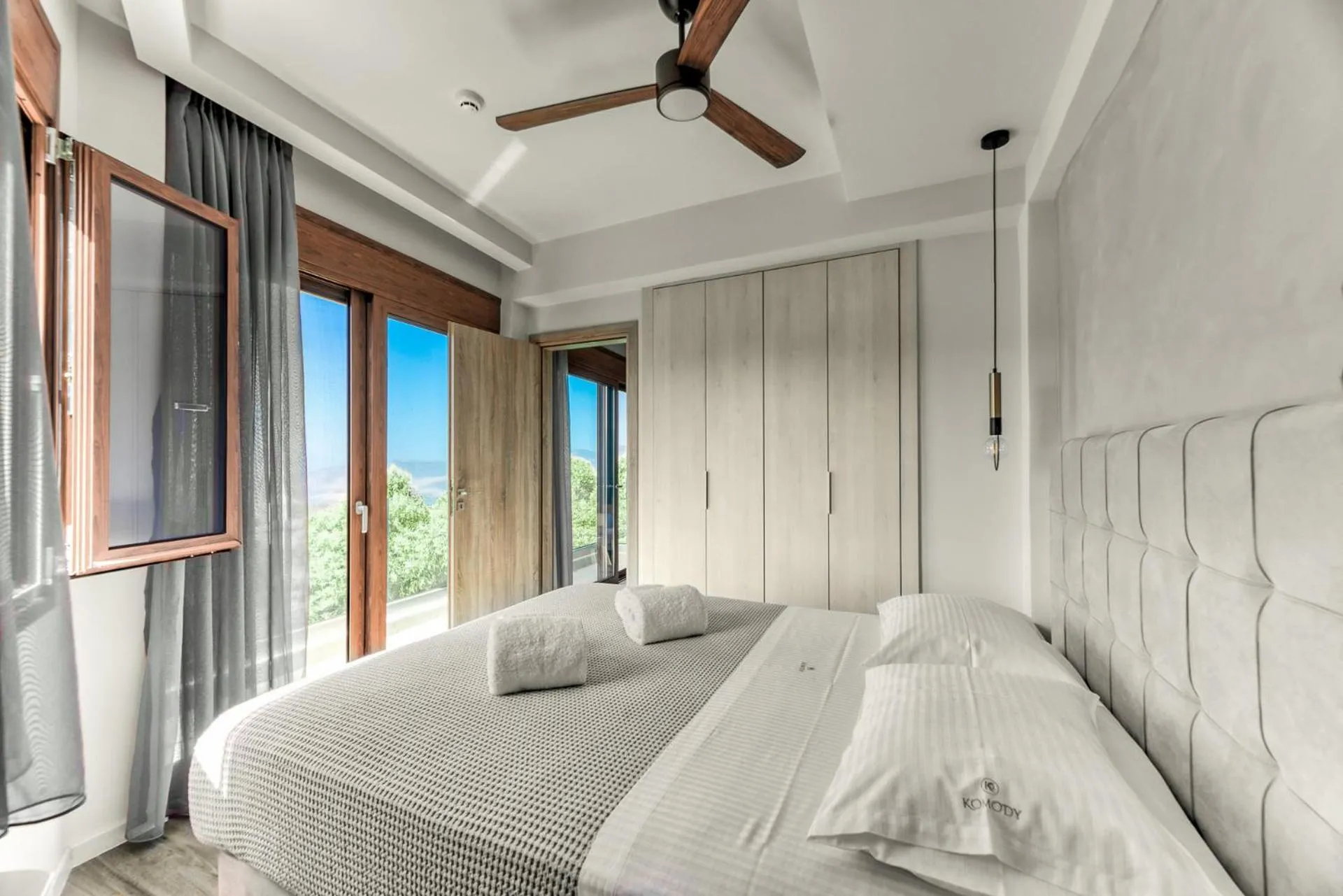 Bed in Komody Apartments