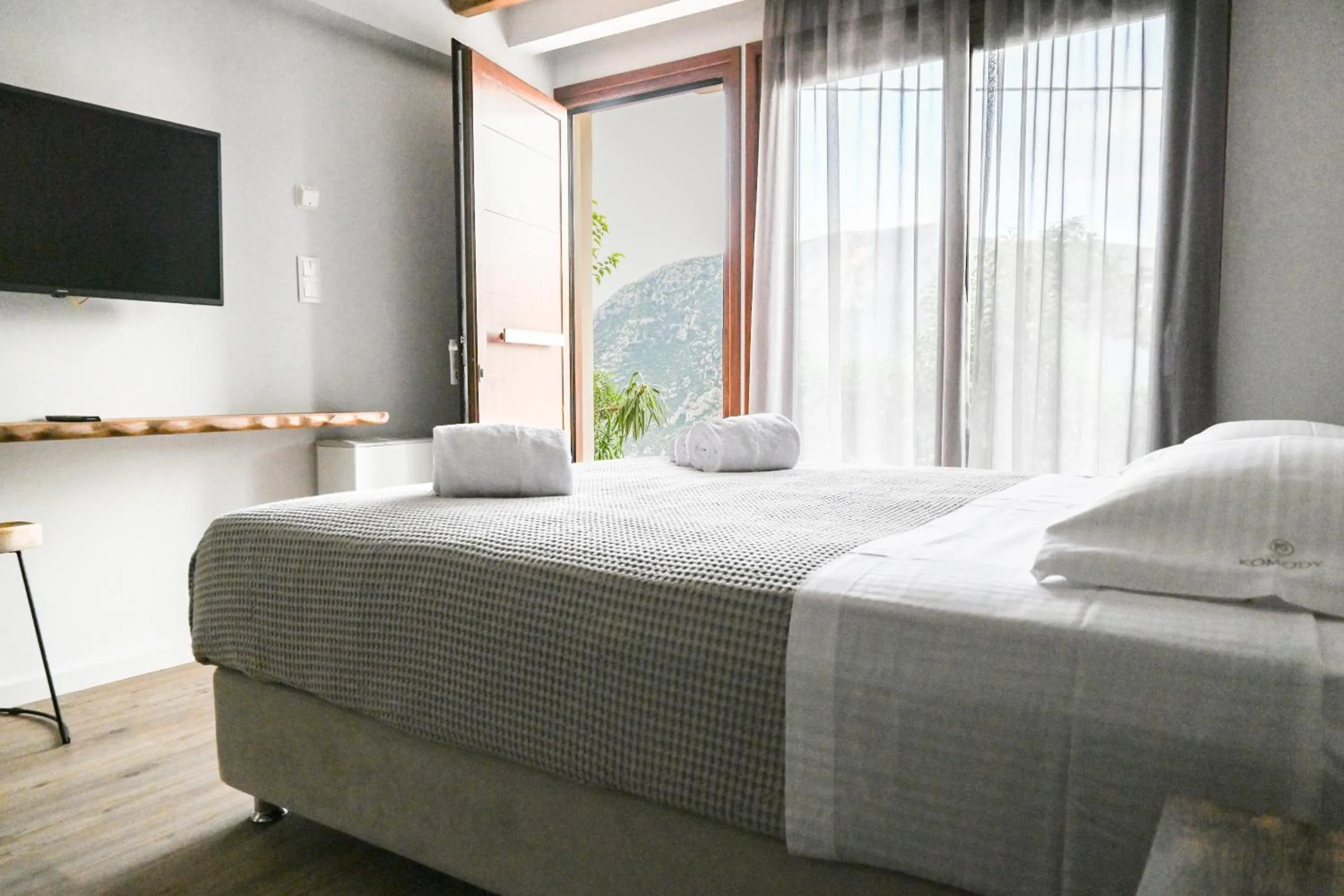 Bed in Komody Apartments