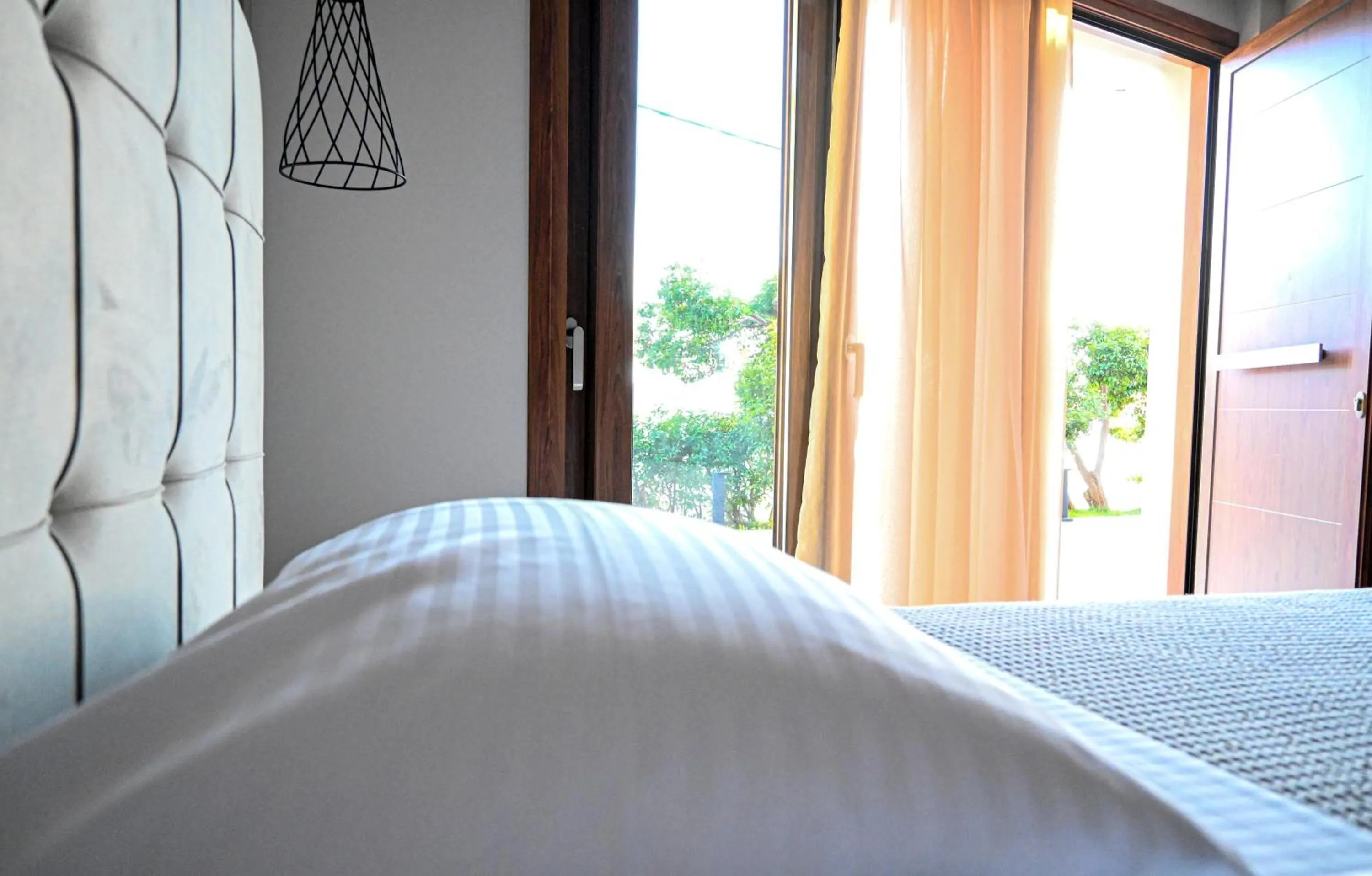 Bed in Komody Apartments