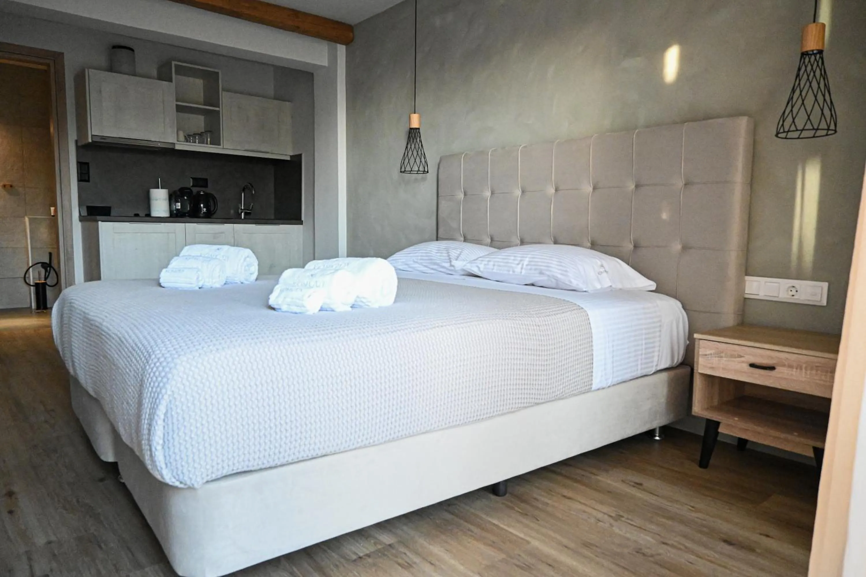 Bed in Komody Apartments