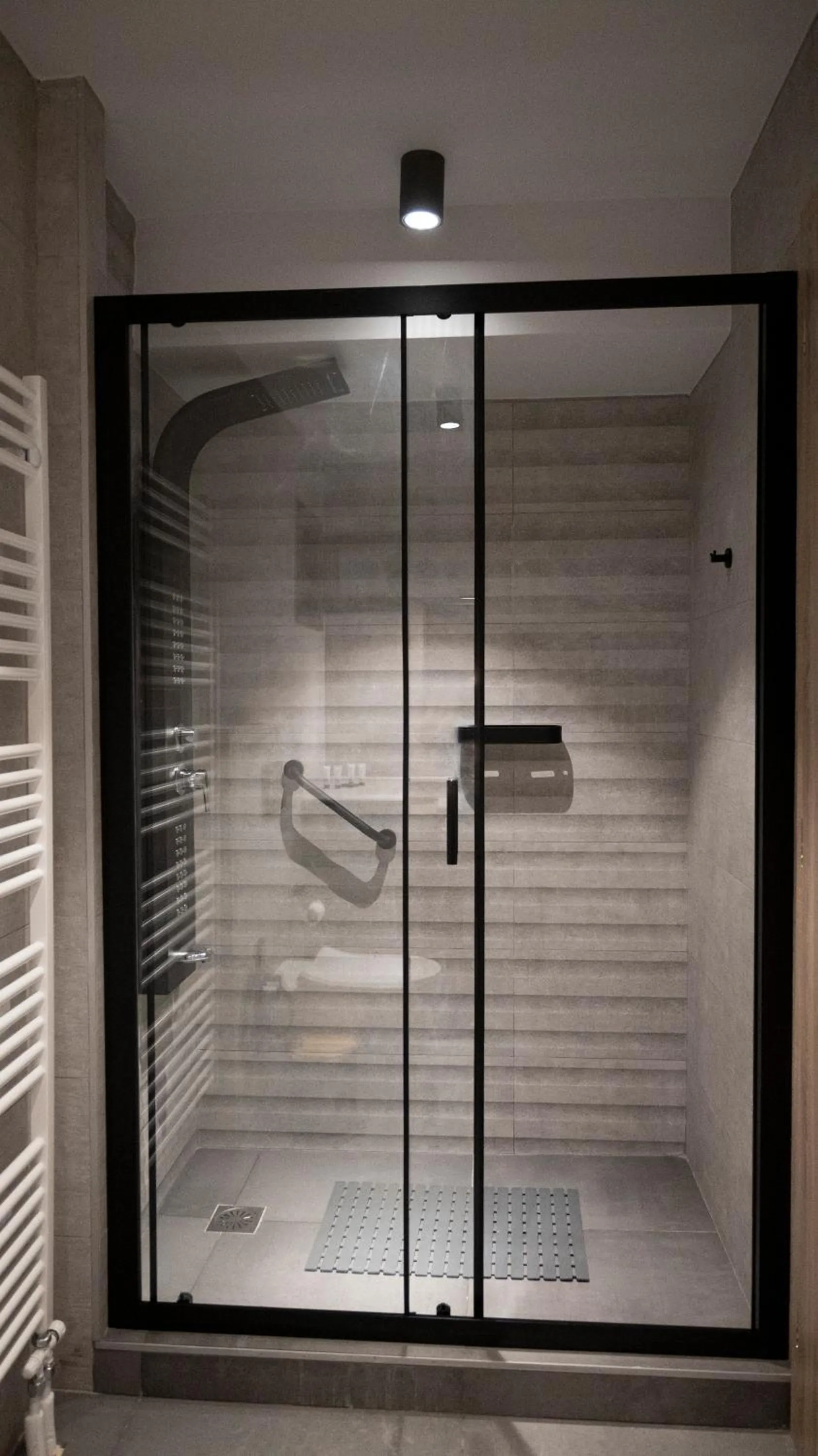 Shower in Komody Apartments