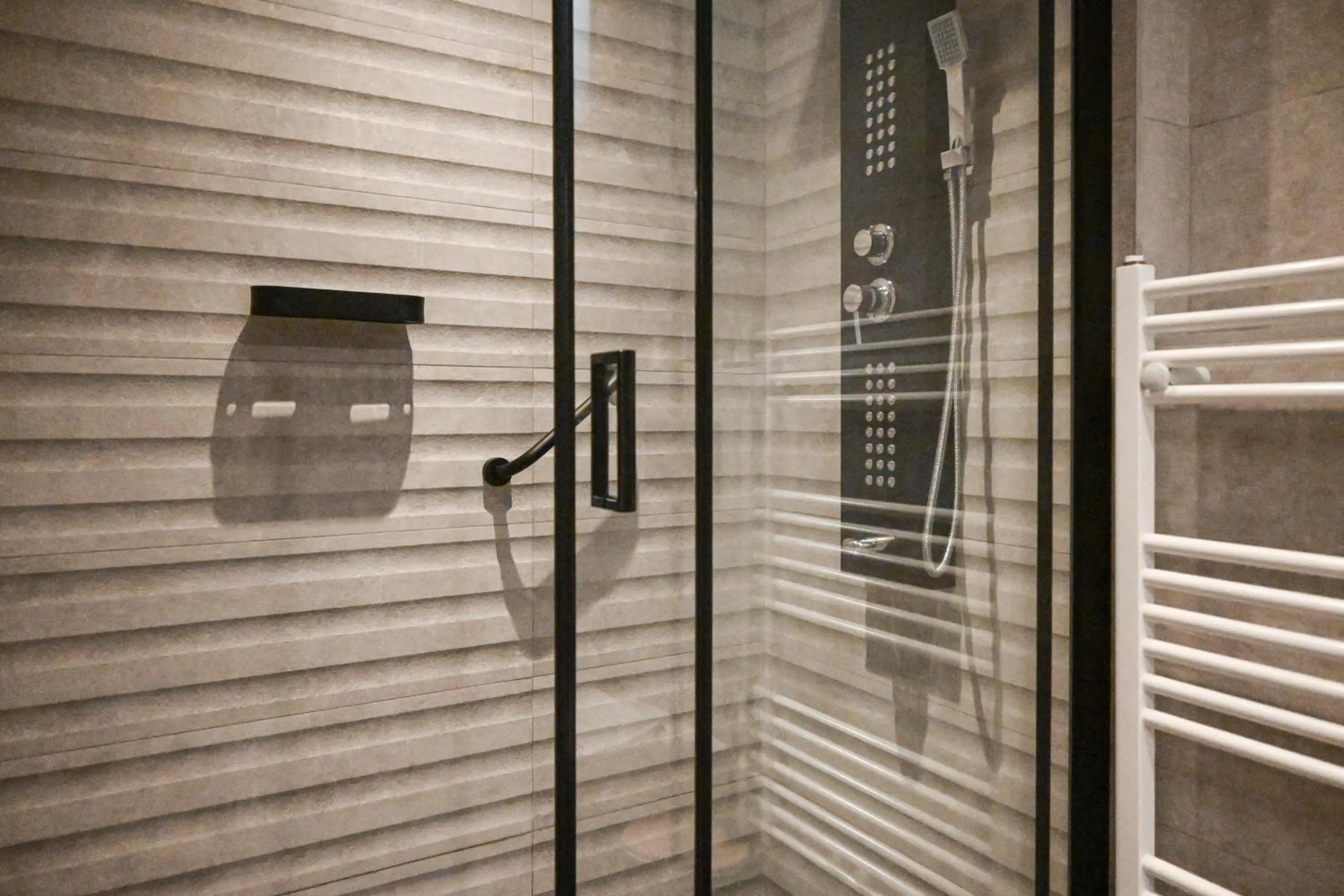 Shower in Komody Apartments