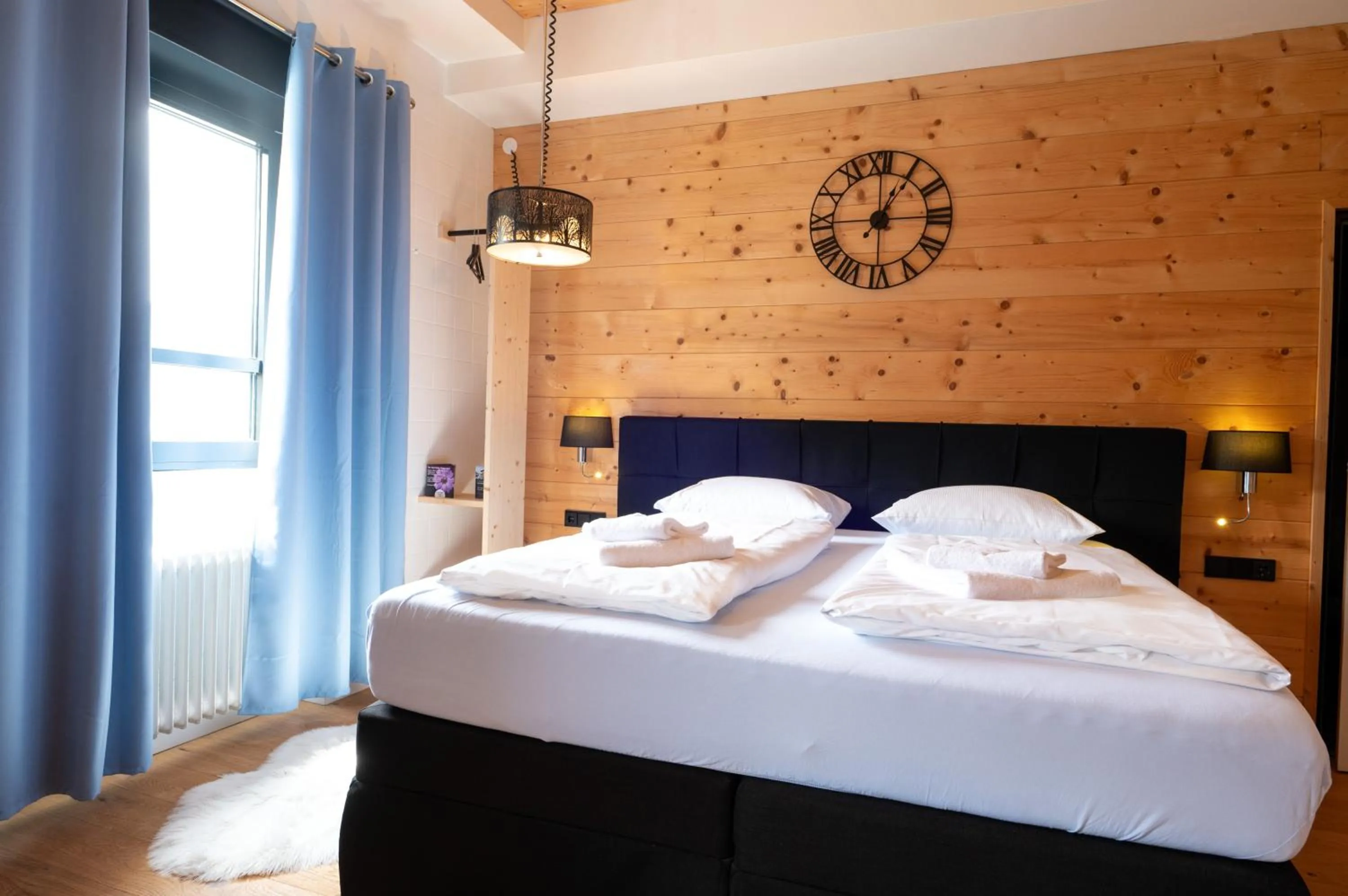 Bedroom, Bed in Design Hotel ALPENLIEBE - - - - Boutique-Flair - - - -