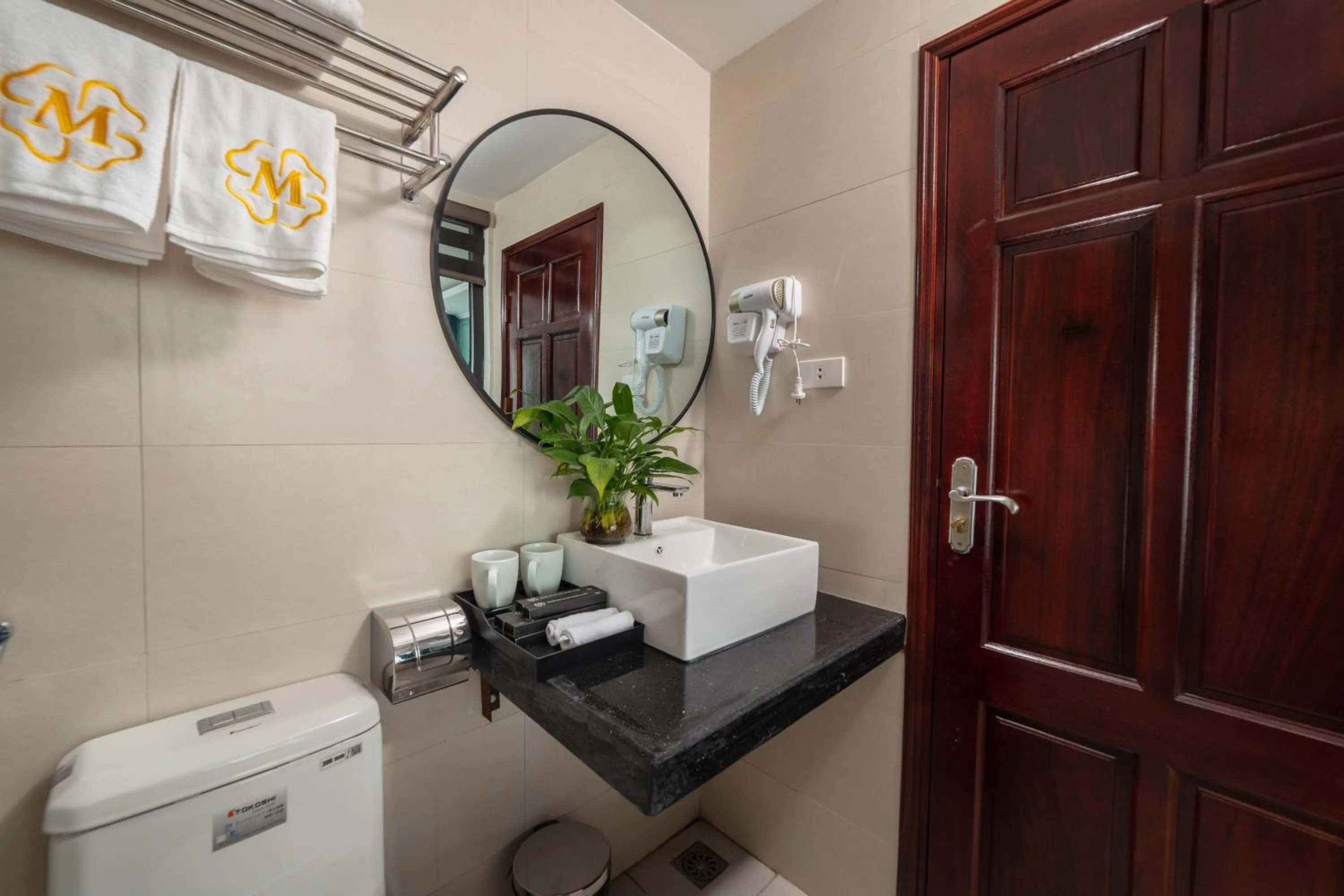 Toilet in Madelise Adora Hotel & Travel