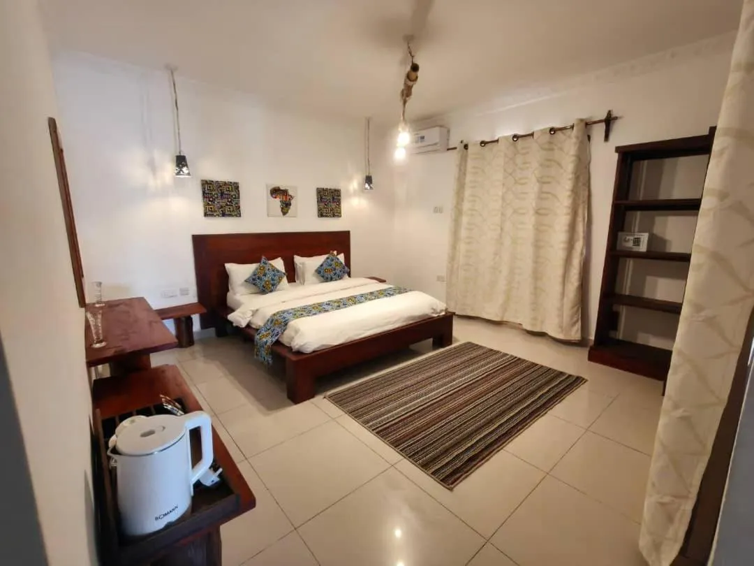 Bed in BIANCO AZZURRO Hotel & Restaurant