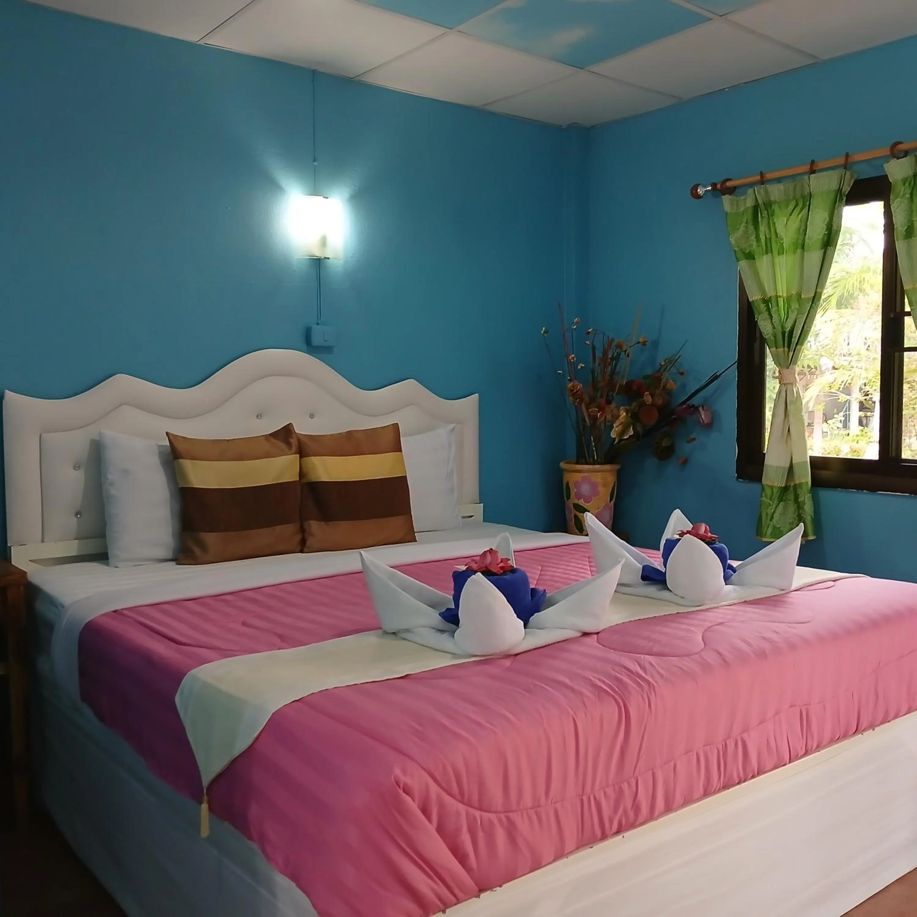 Bed in Thai Garden​ Resort​ Kanchanaburi​
