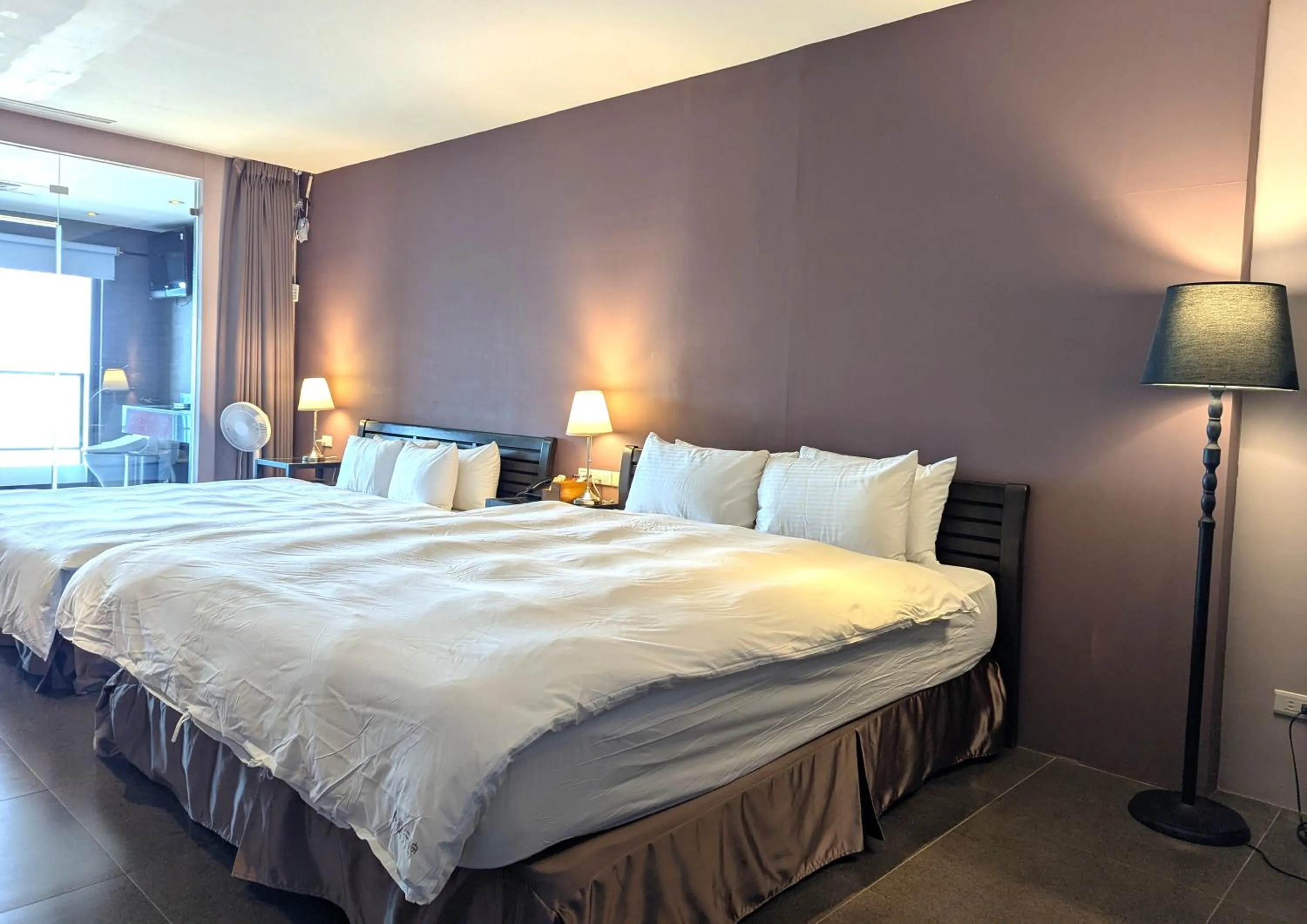 Bed in Jing Guan Hotel