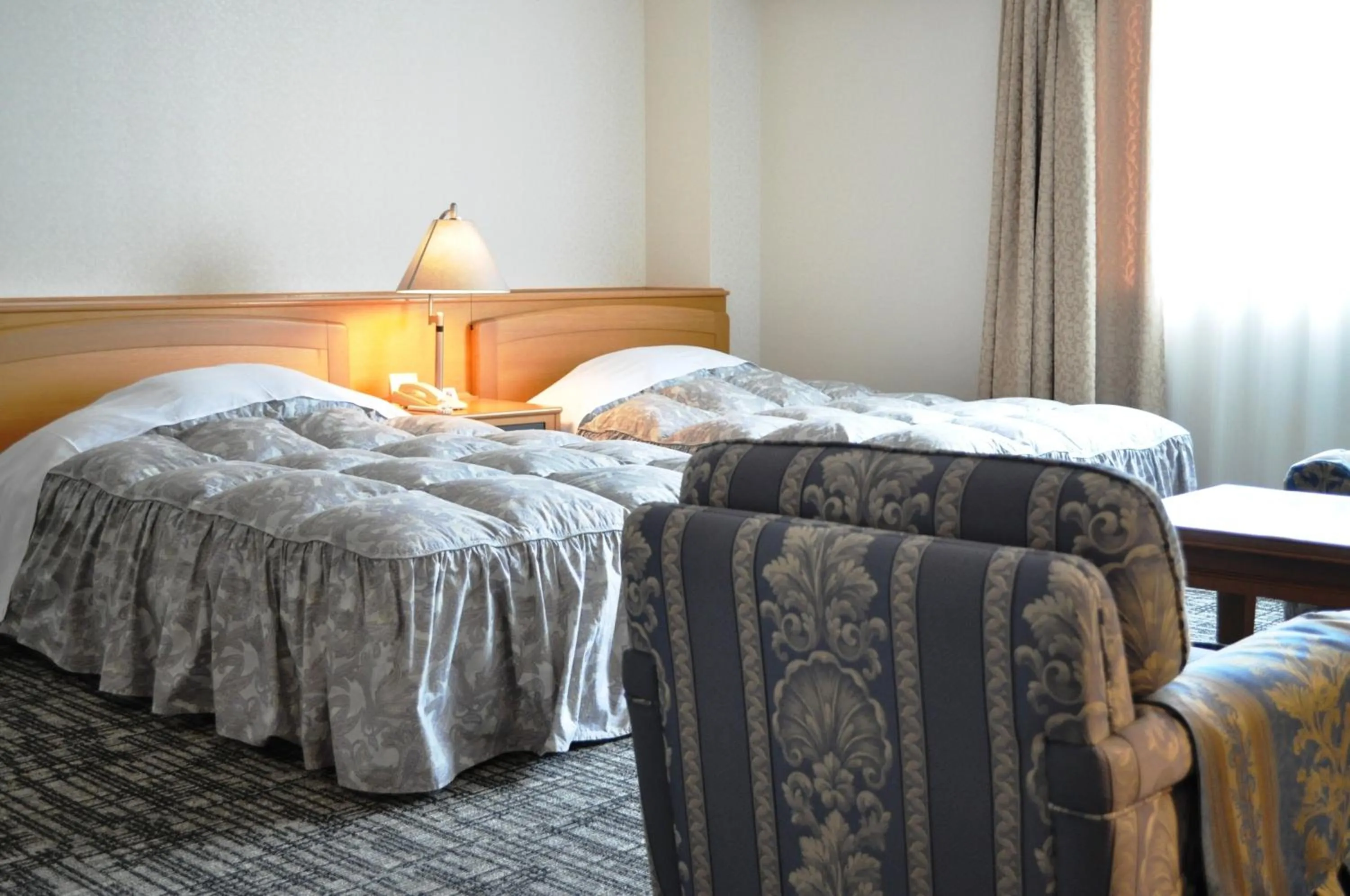 Bed in Tateyama Kokusai Hotel