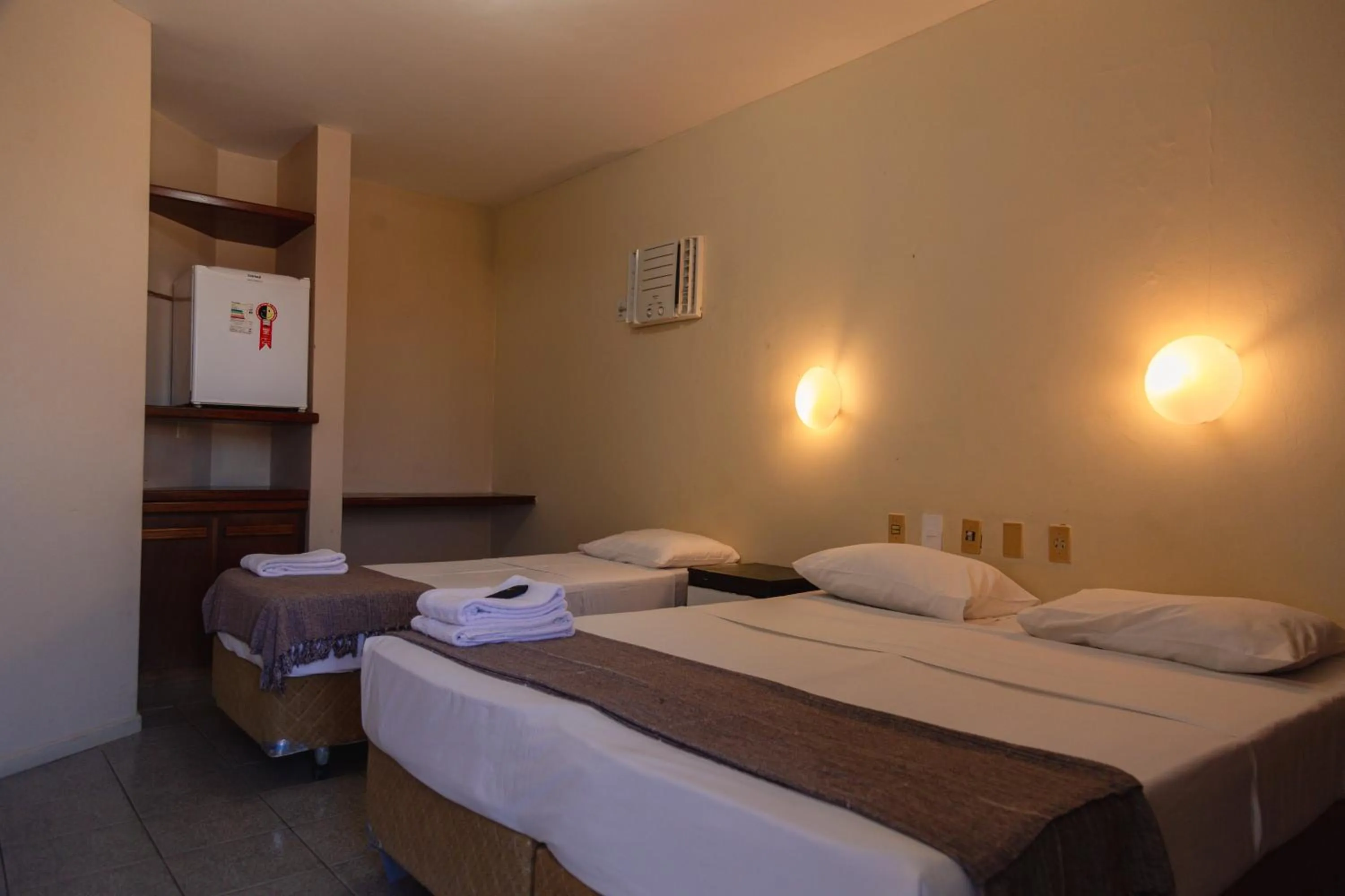 Photo of the whole room, Bed in HANNA Praia Hotel - Florianópolis