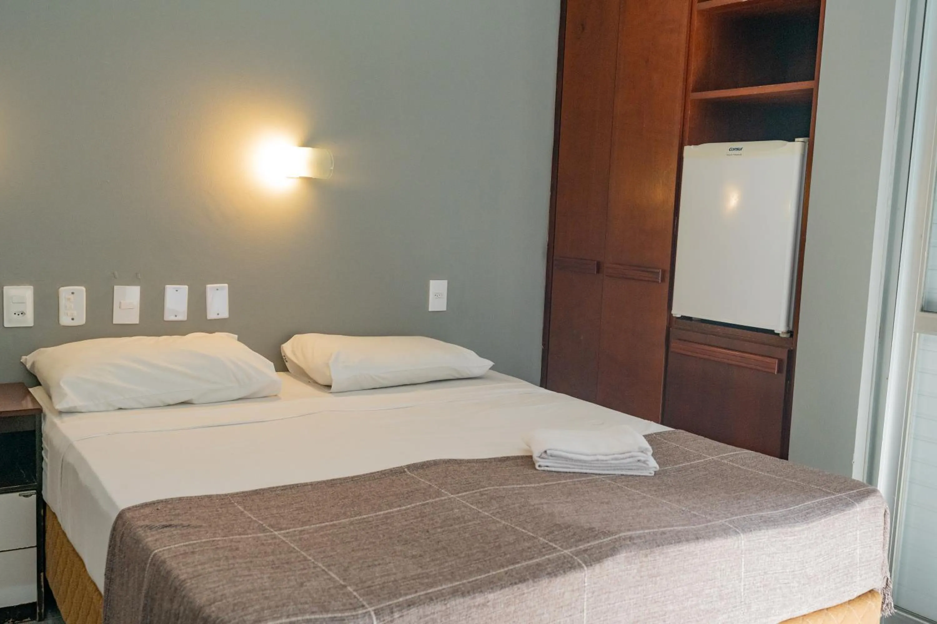 Photo of the whole room, Bed in HANNA Praia Hotel - Florianópolis