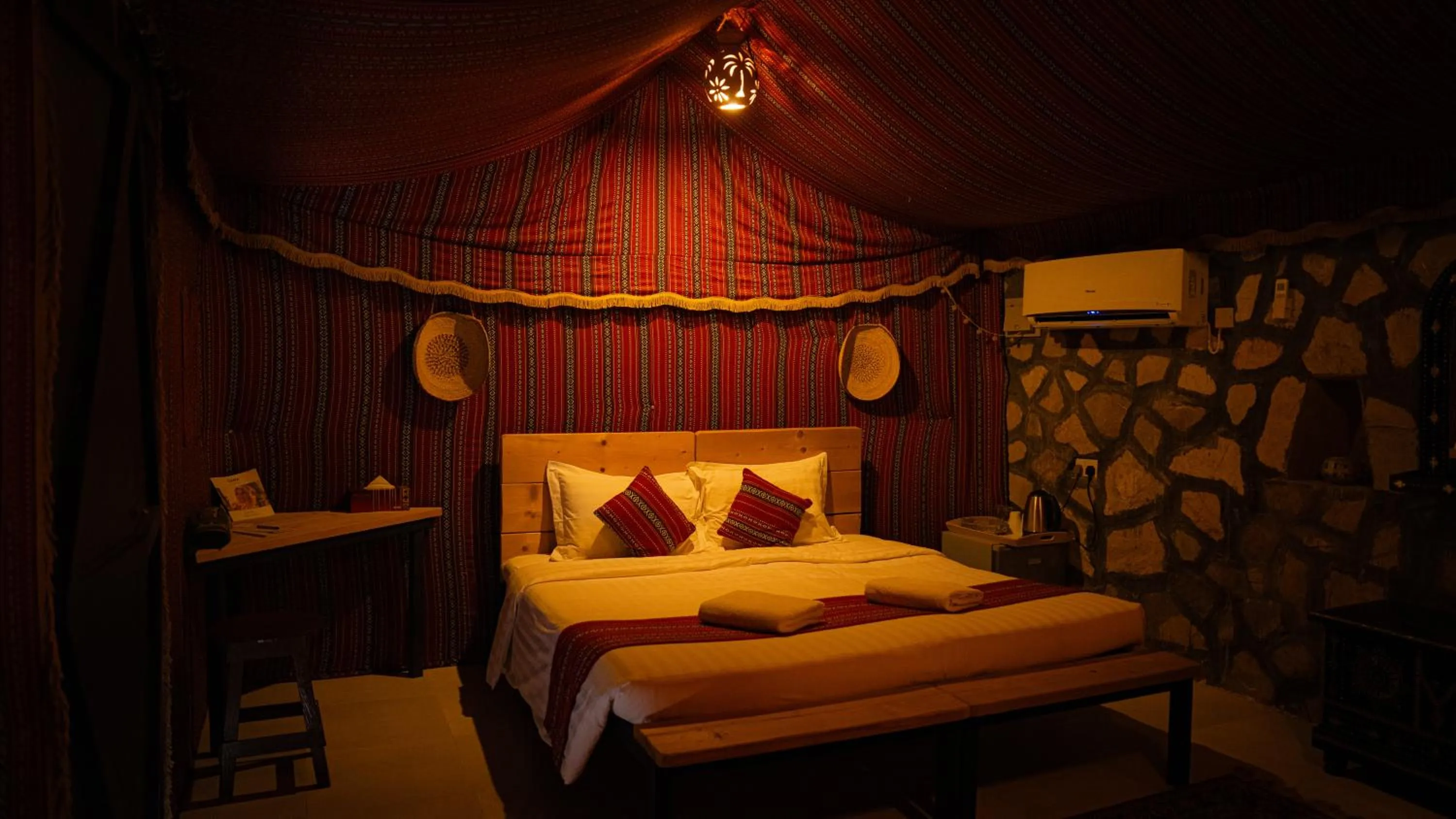 Bed in Sama al Wasil Desert Camp