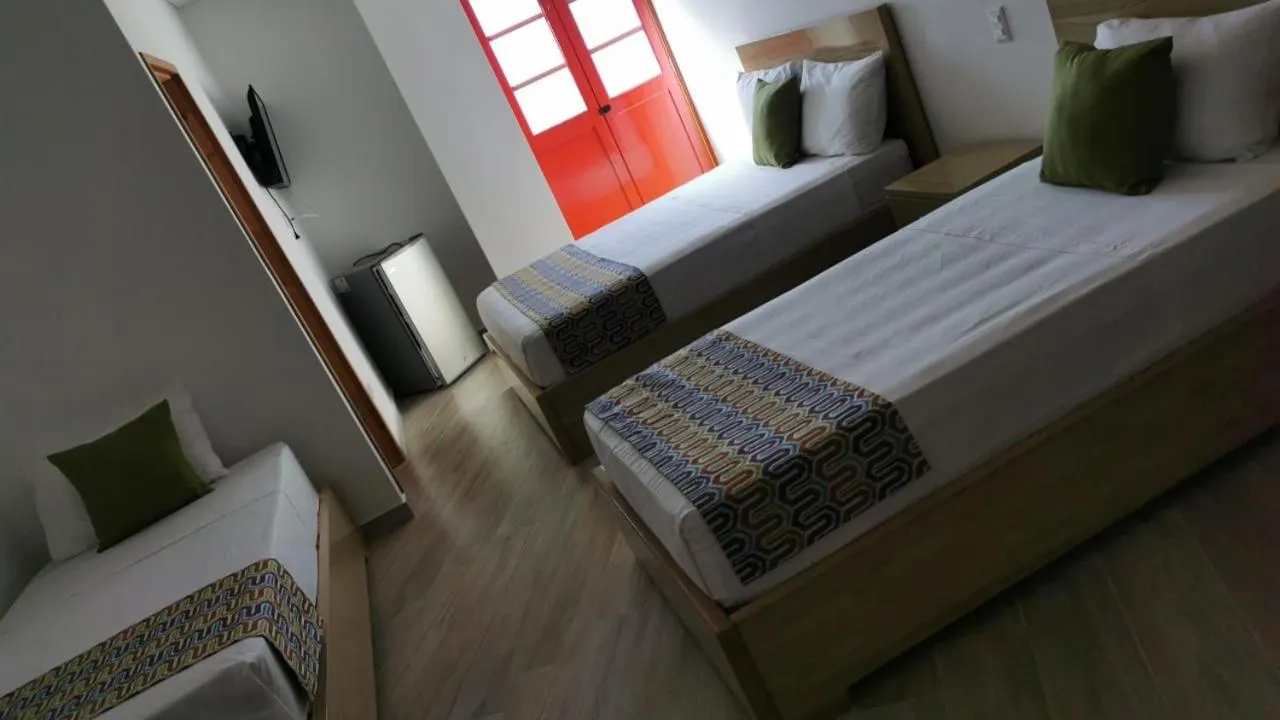 Bed in ALTO VERDE HOTEL
