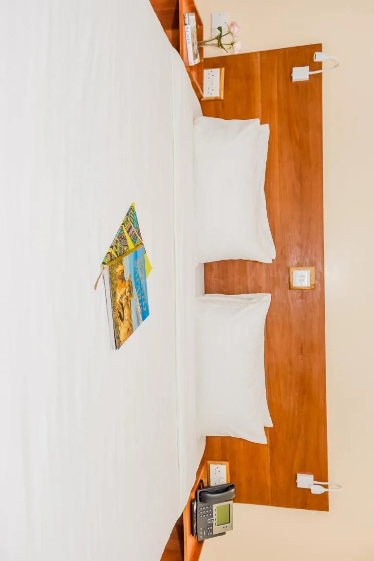 Bed in The Glacier Hotel Nanyuki