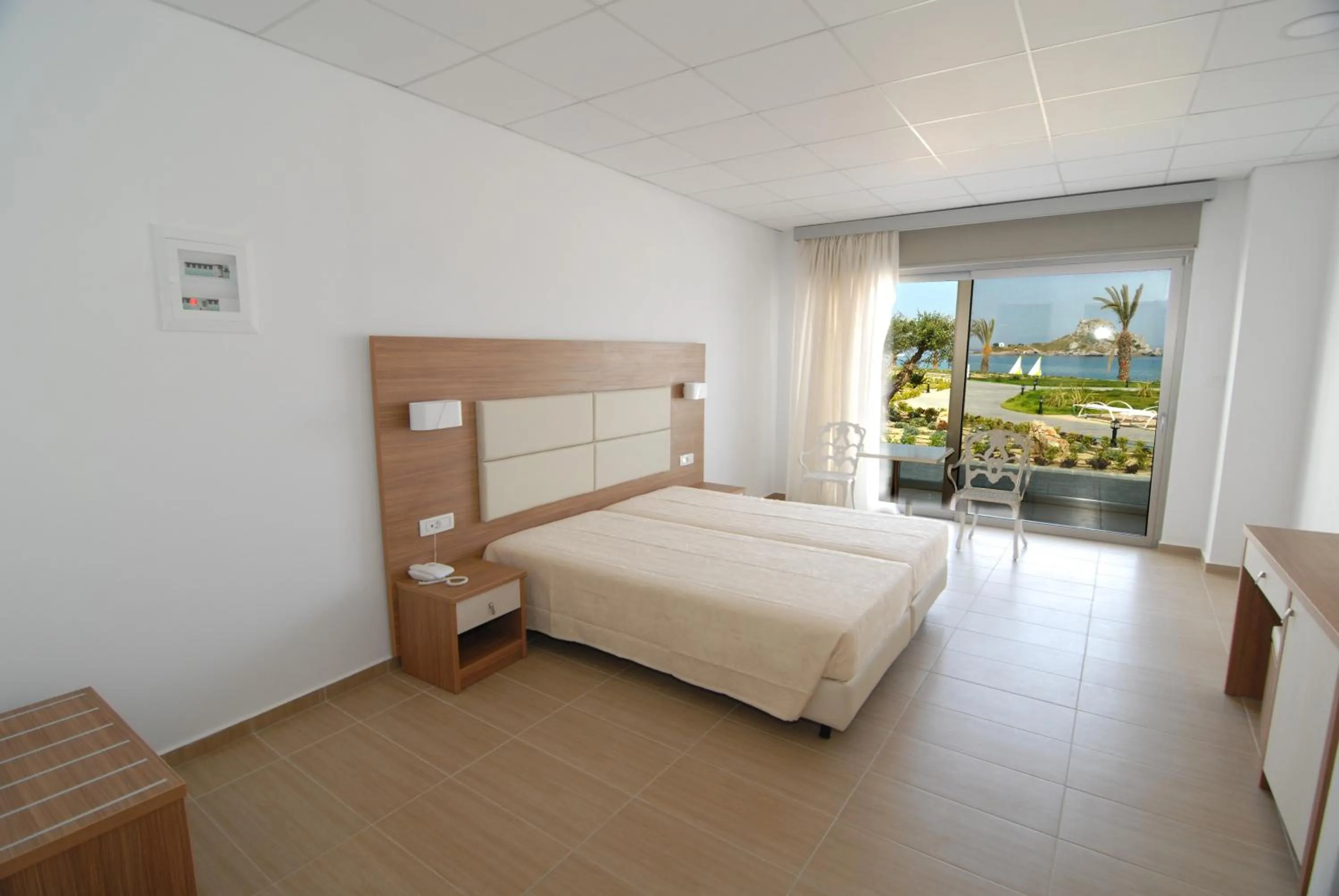 Bed in Royal Bay Suites