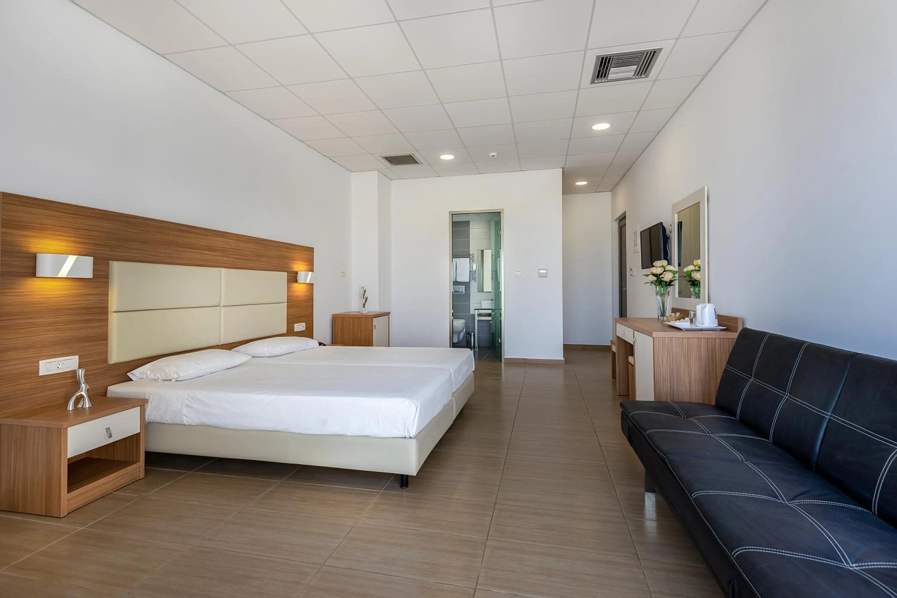 Bedroom, Bed in Royal Bay Suites