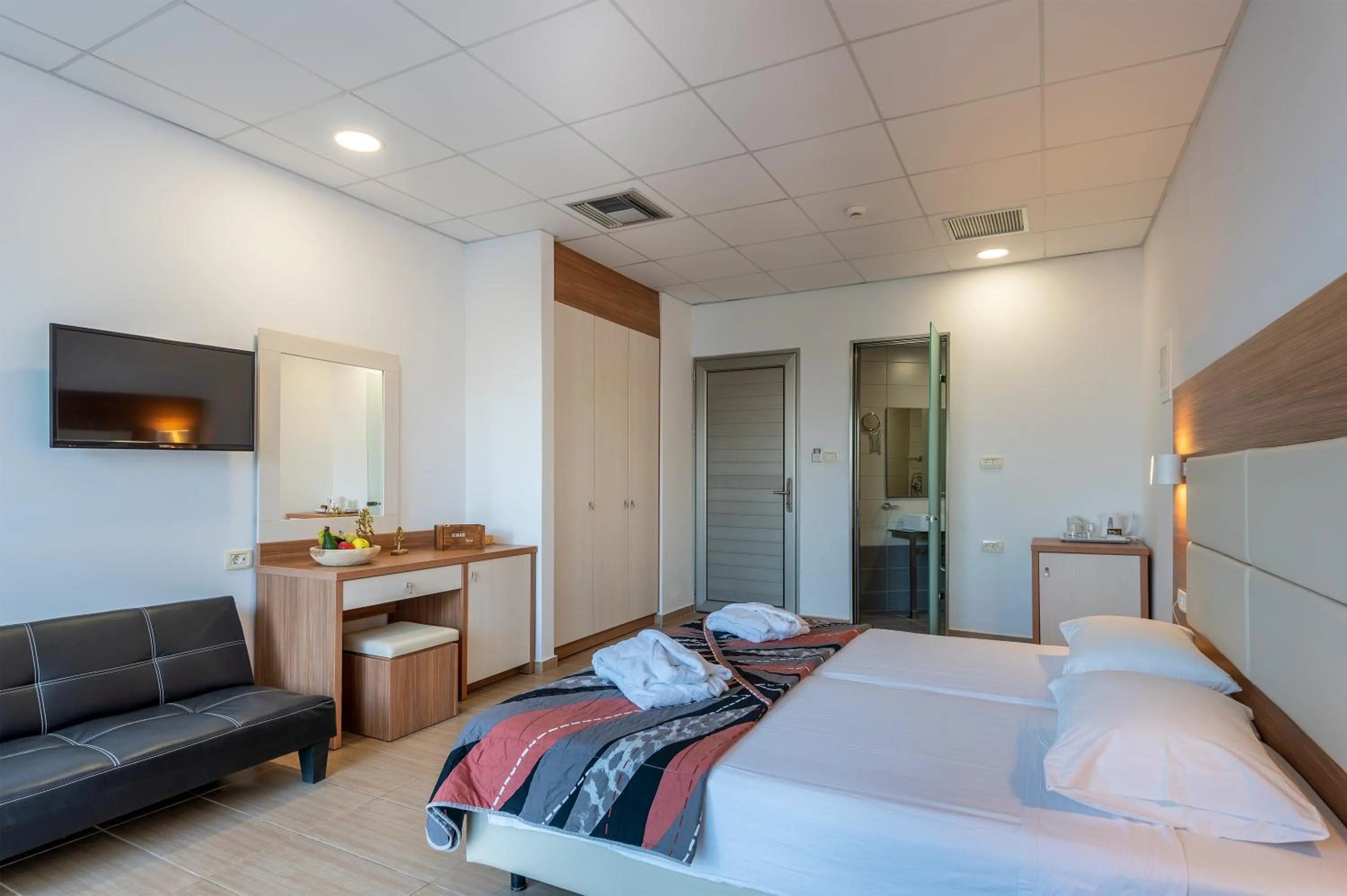 Photo of the whole room, Bed in Royal Bay Suites