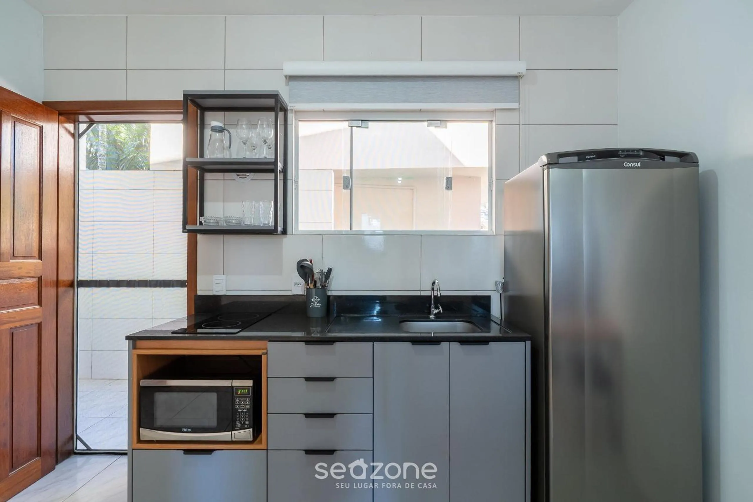 Kitchen or kitchenette in Apartamentos em Jurerê - JMA