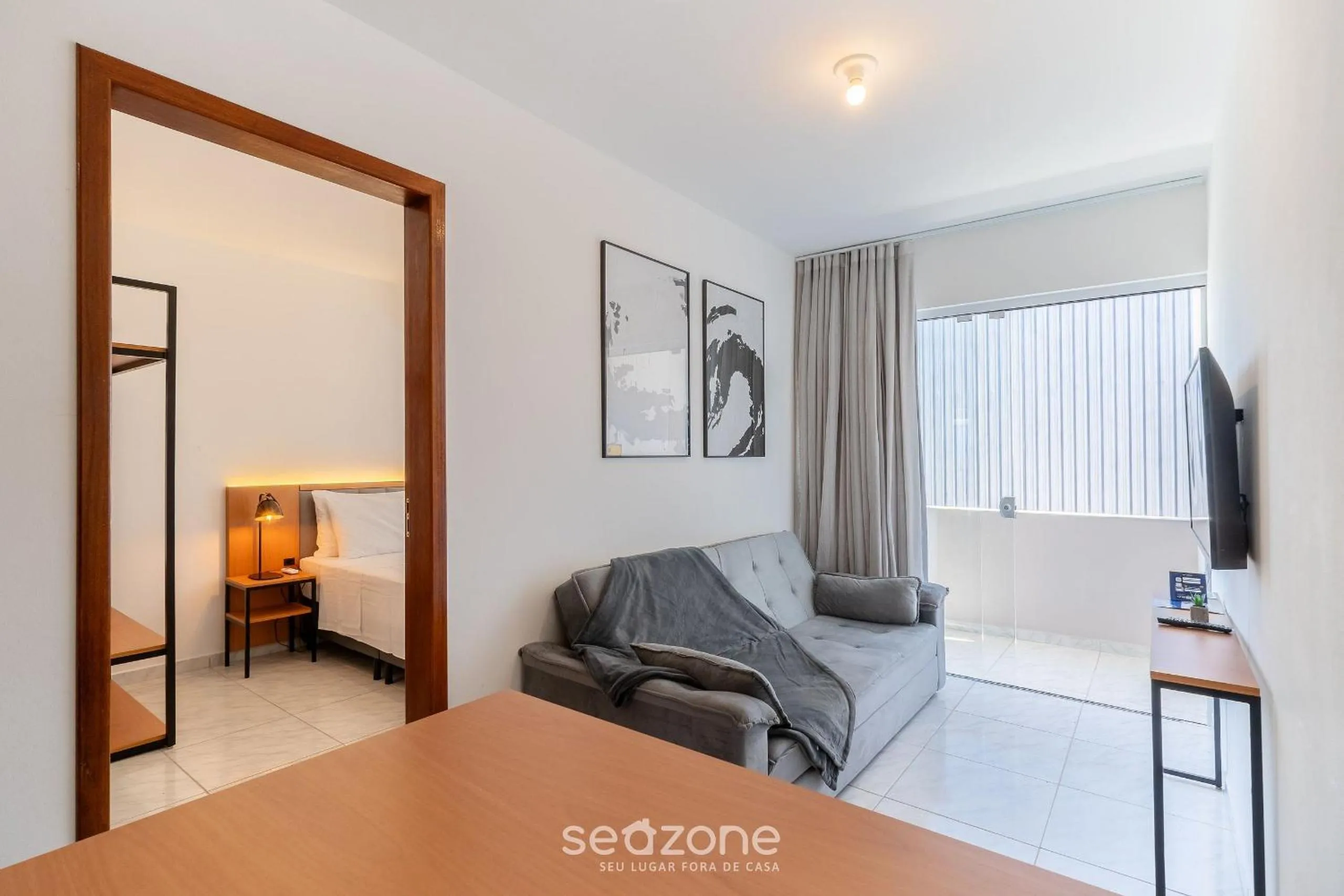 Living room, Bed in Apartamentos em Jurerê - JMA