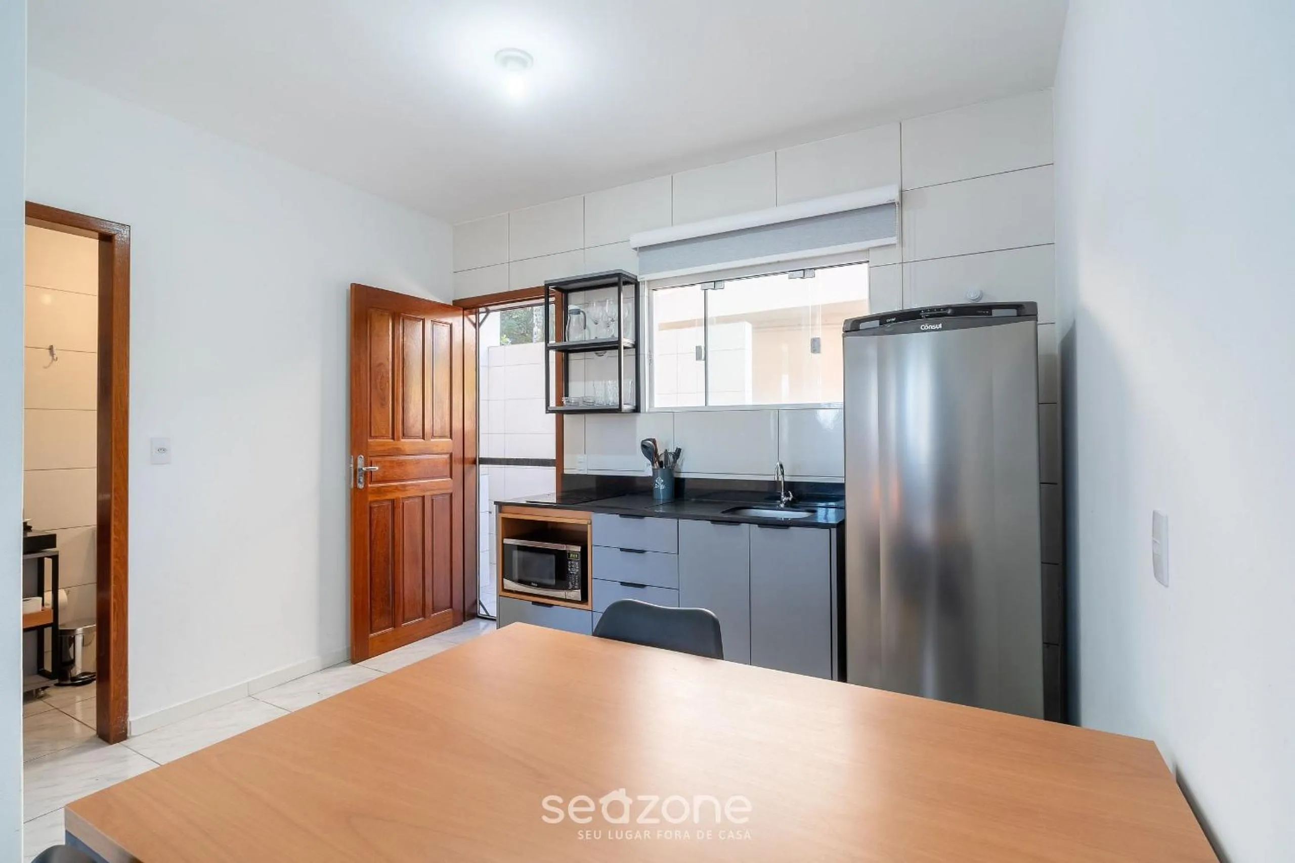 Kitchen or kitchenette in Apartamentos em Jurerê - JMA