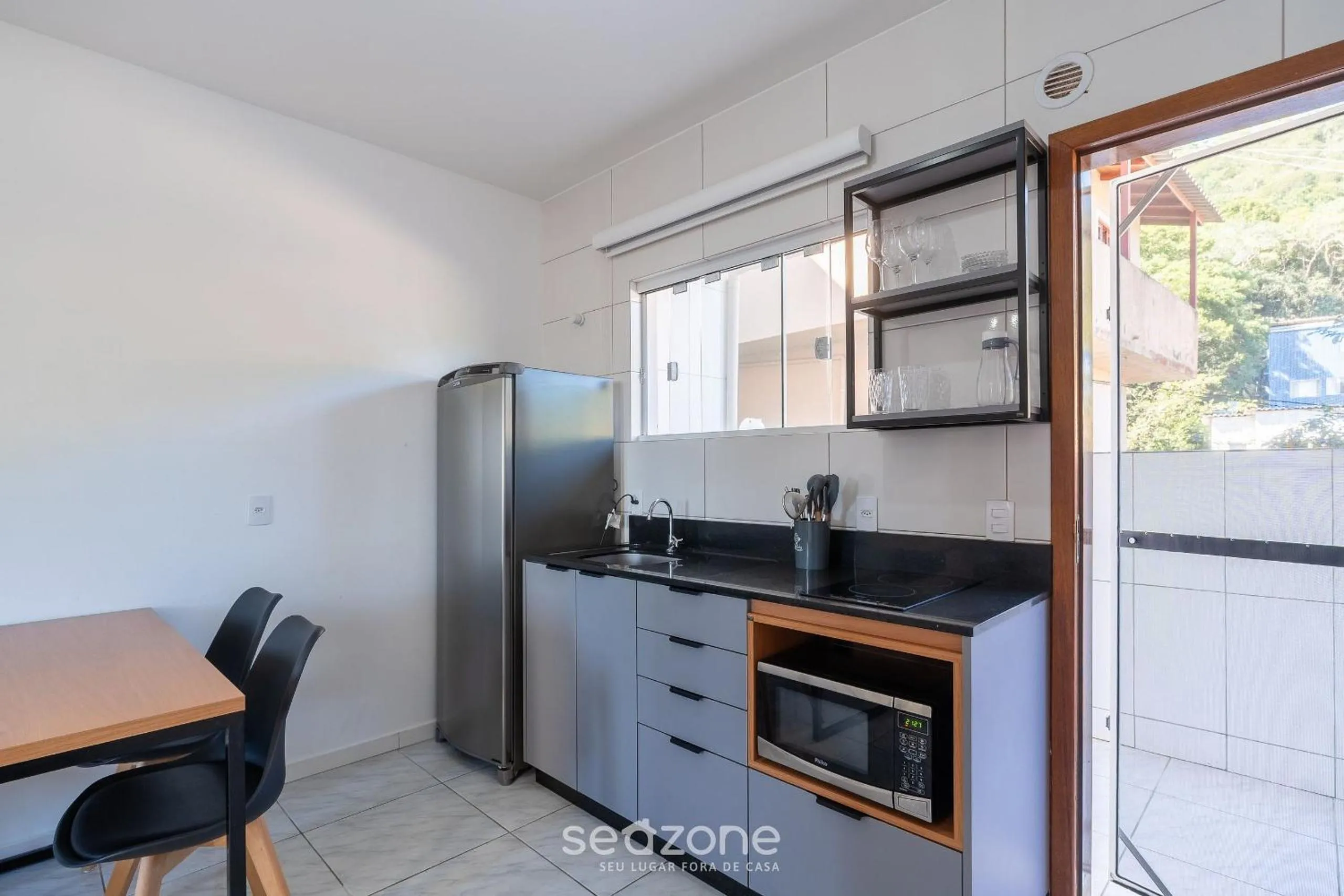 Kitchen or kitchenette in Apartamentos em Jurerê - JMA