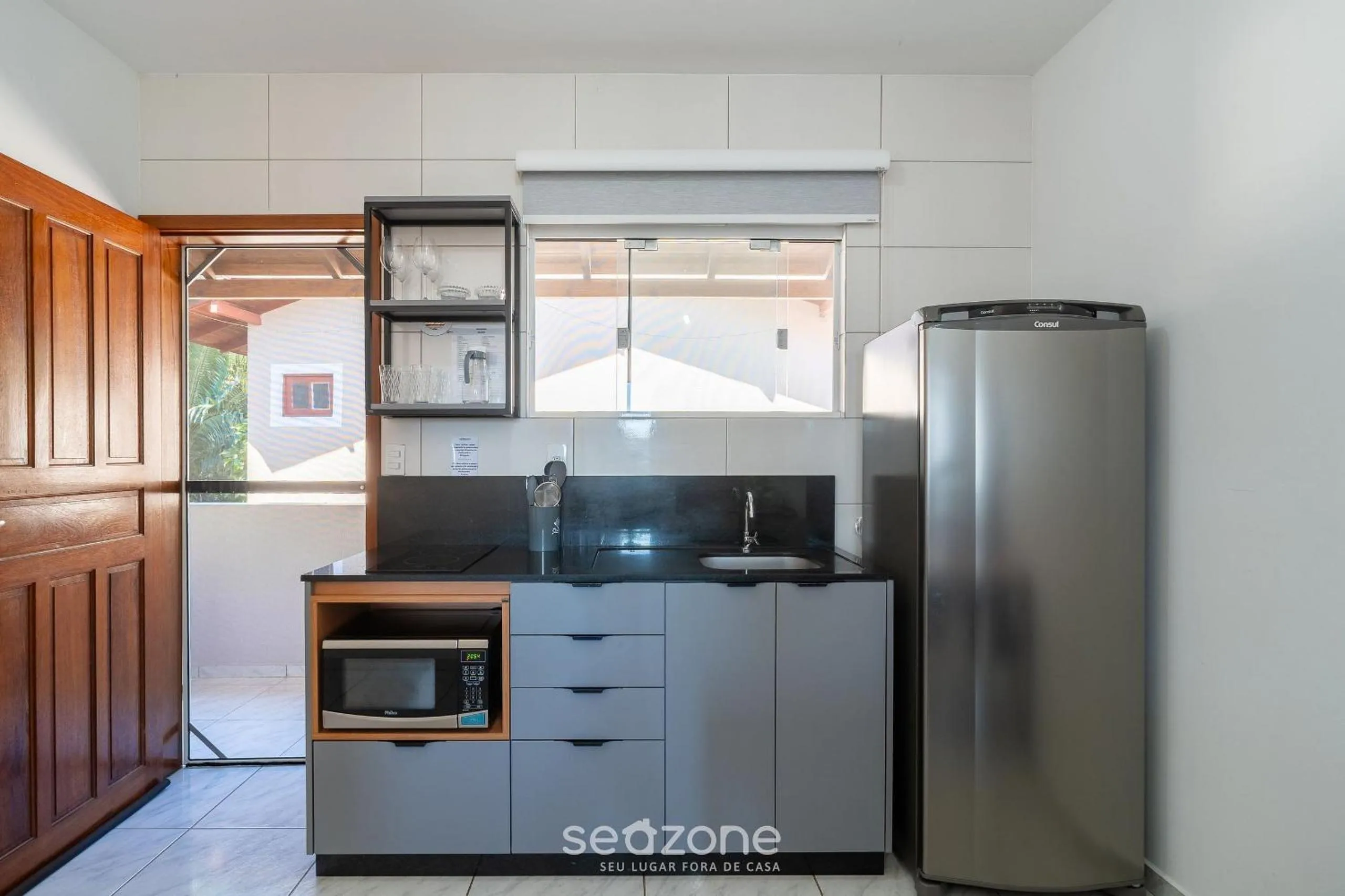 Kitchen or kitchenette in Apartamentos em Jurerê - JMA