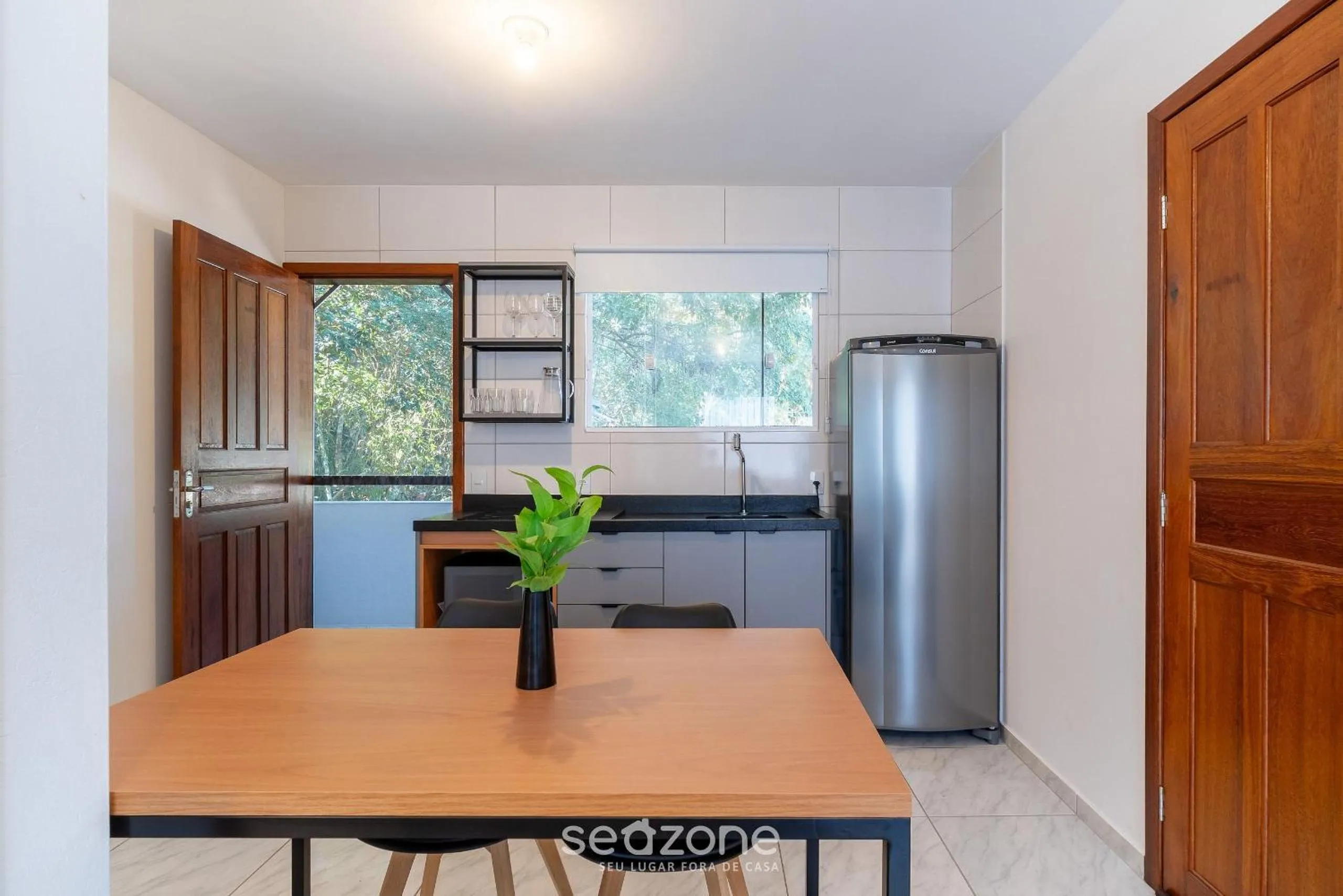 Kitchen or kitchenette in Apartamentos em Jurerê - JMA