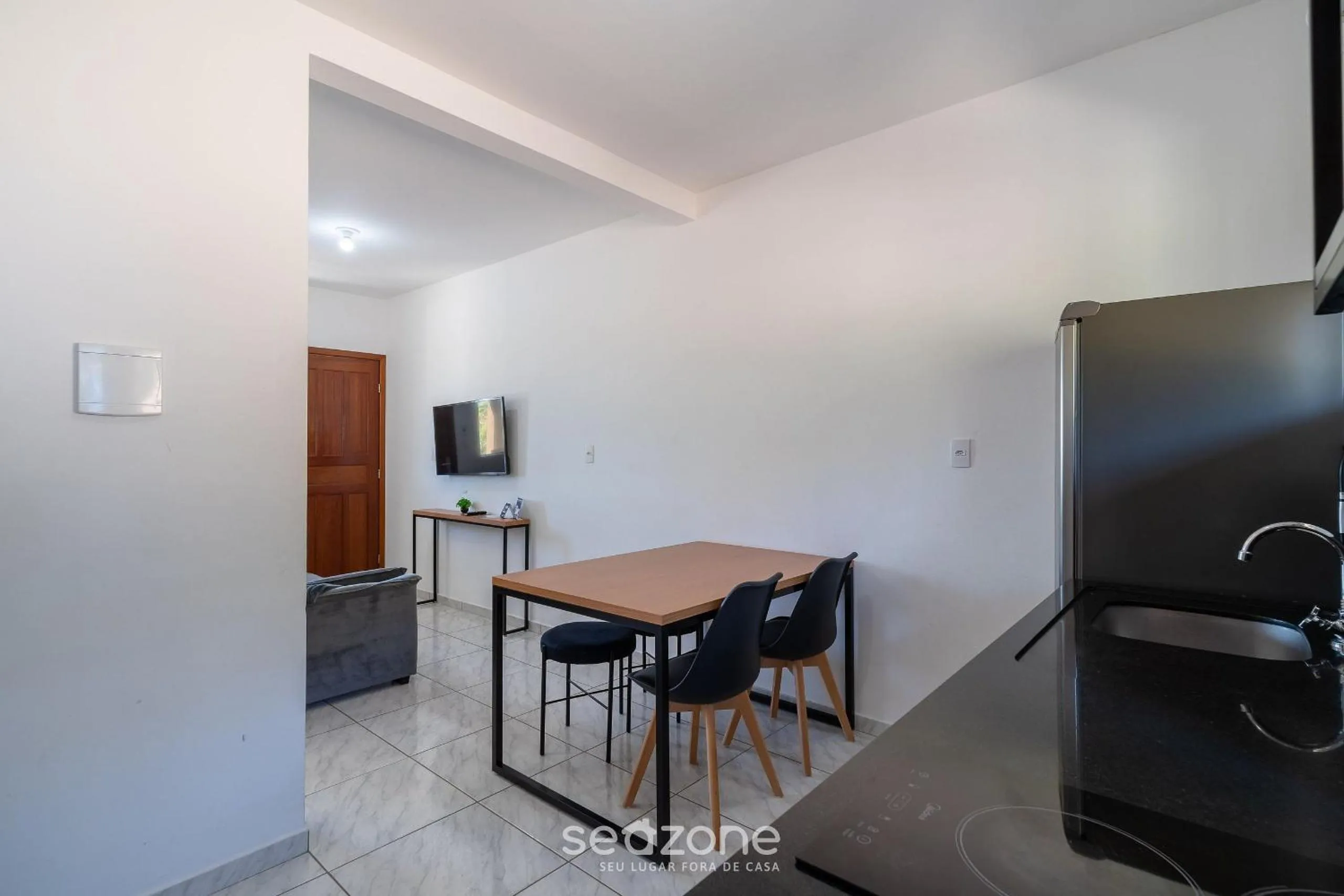 Kitchen or kitchenette in Apartamentos em Jurerê - JMA