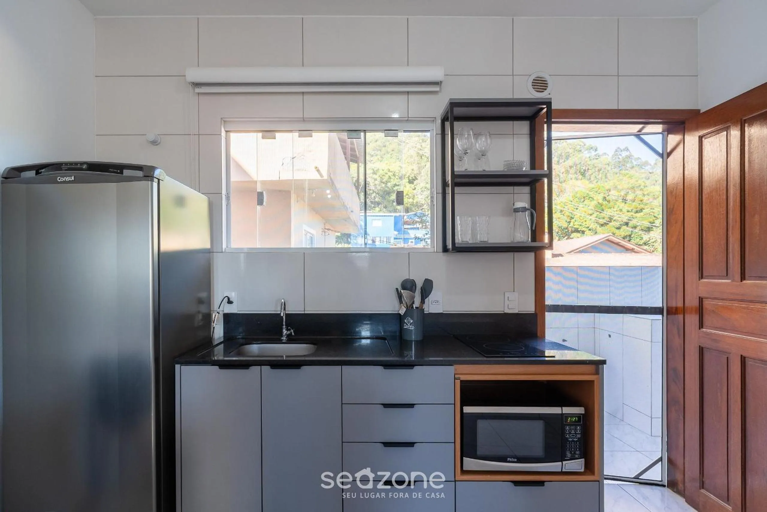 Kitchen or kitchenette in Apartamentos em Jurerê - JMA