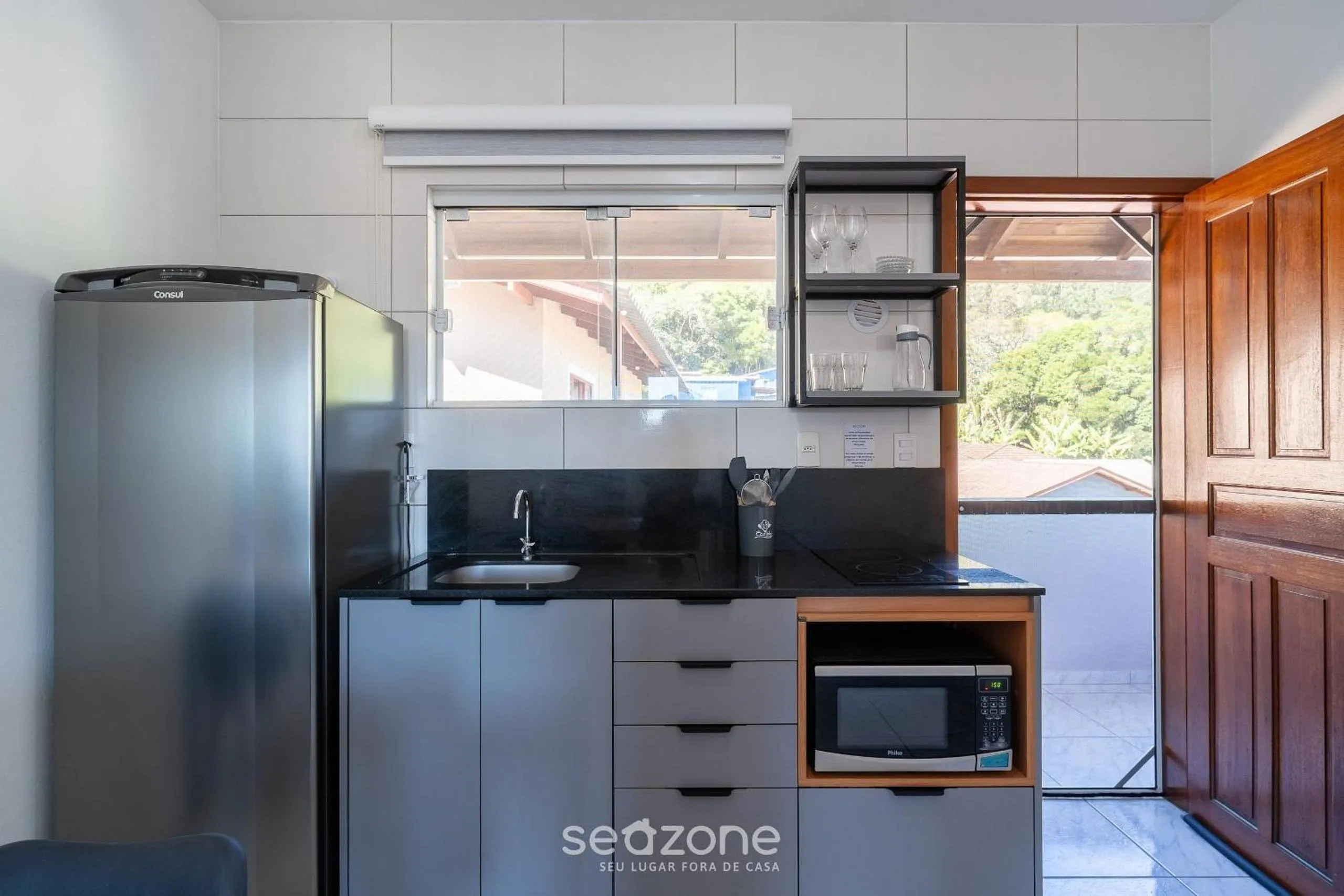 Kitchen or kitchenette in Apartamentos em Jurerê - JMA