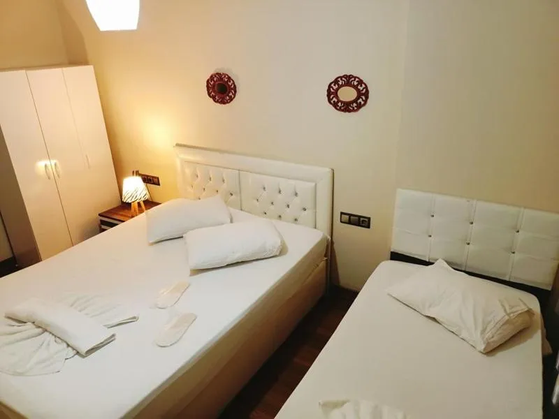 Bed in Doğan Palace Hotel