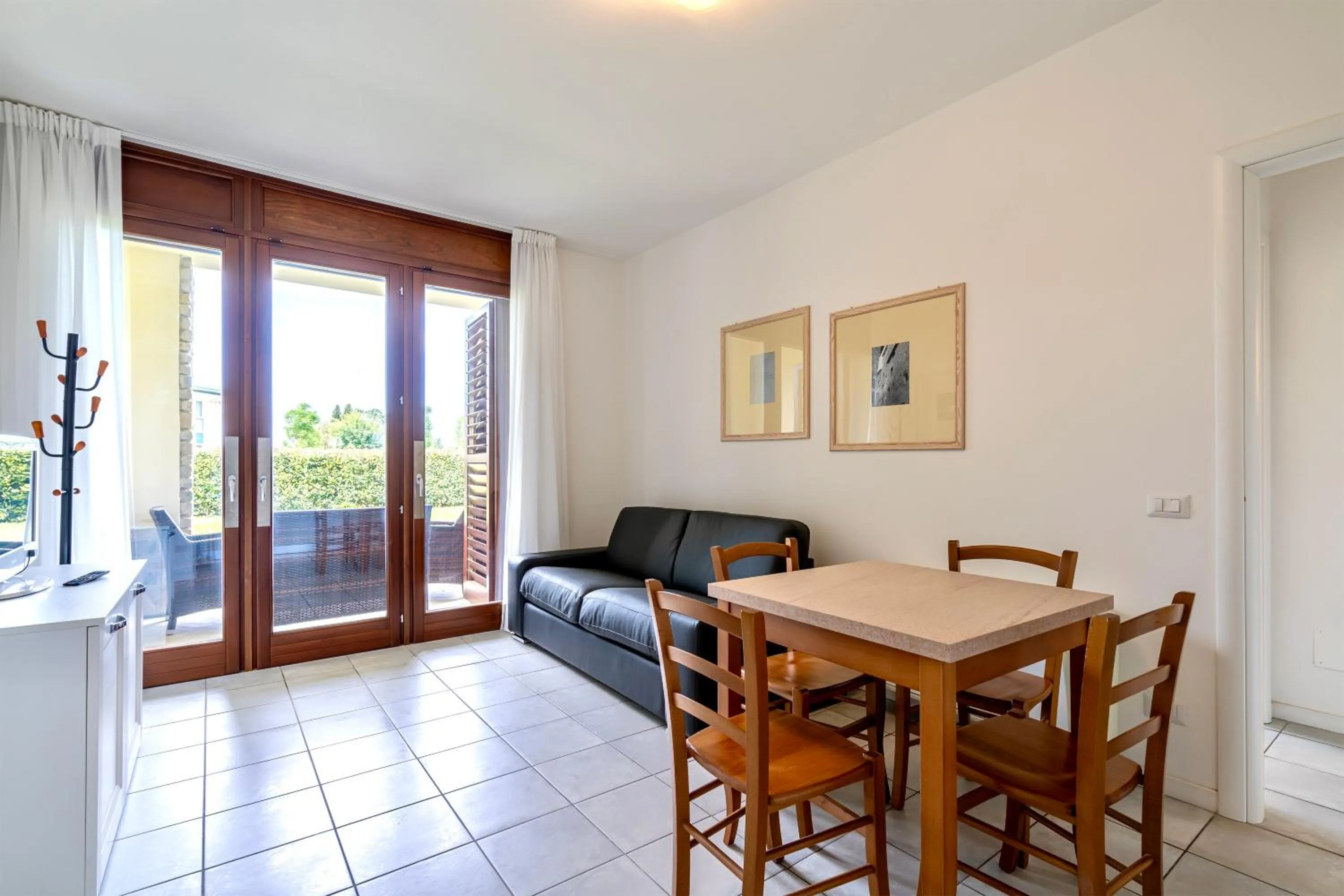 Living room in ISA-Residence with swimming-pool in Barberino-Tavernelle, apartments with air conditioning and private outdoor area