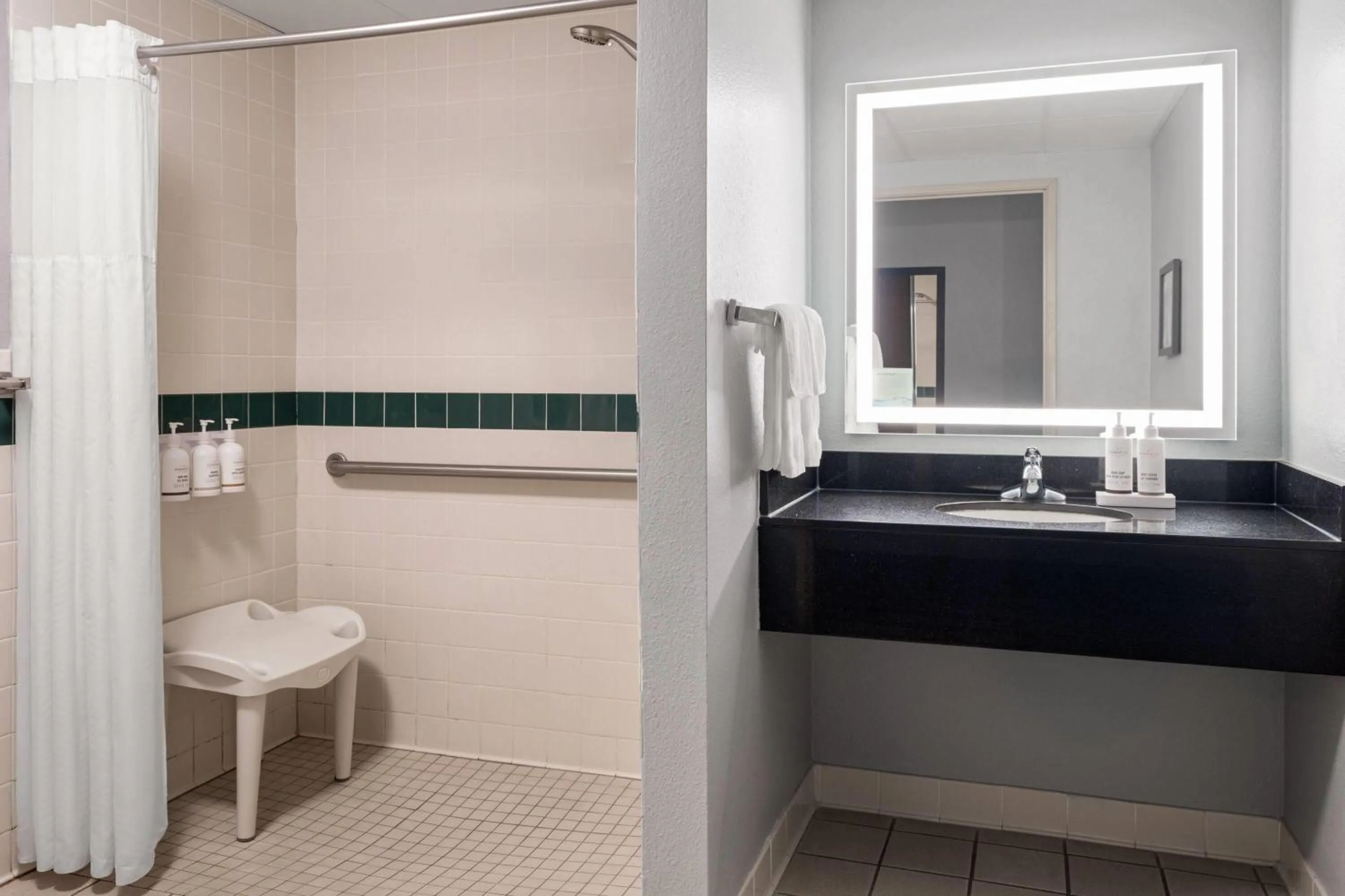 Shower in AmericInn by Wyndham Grand Forks