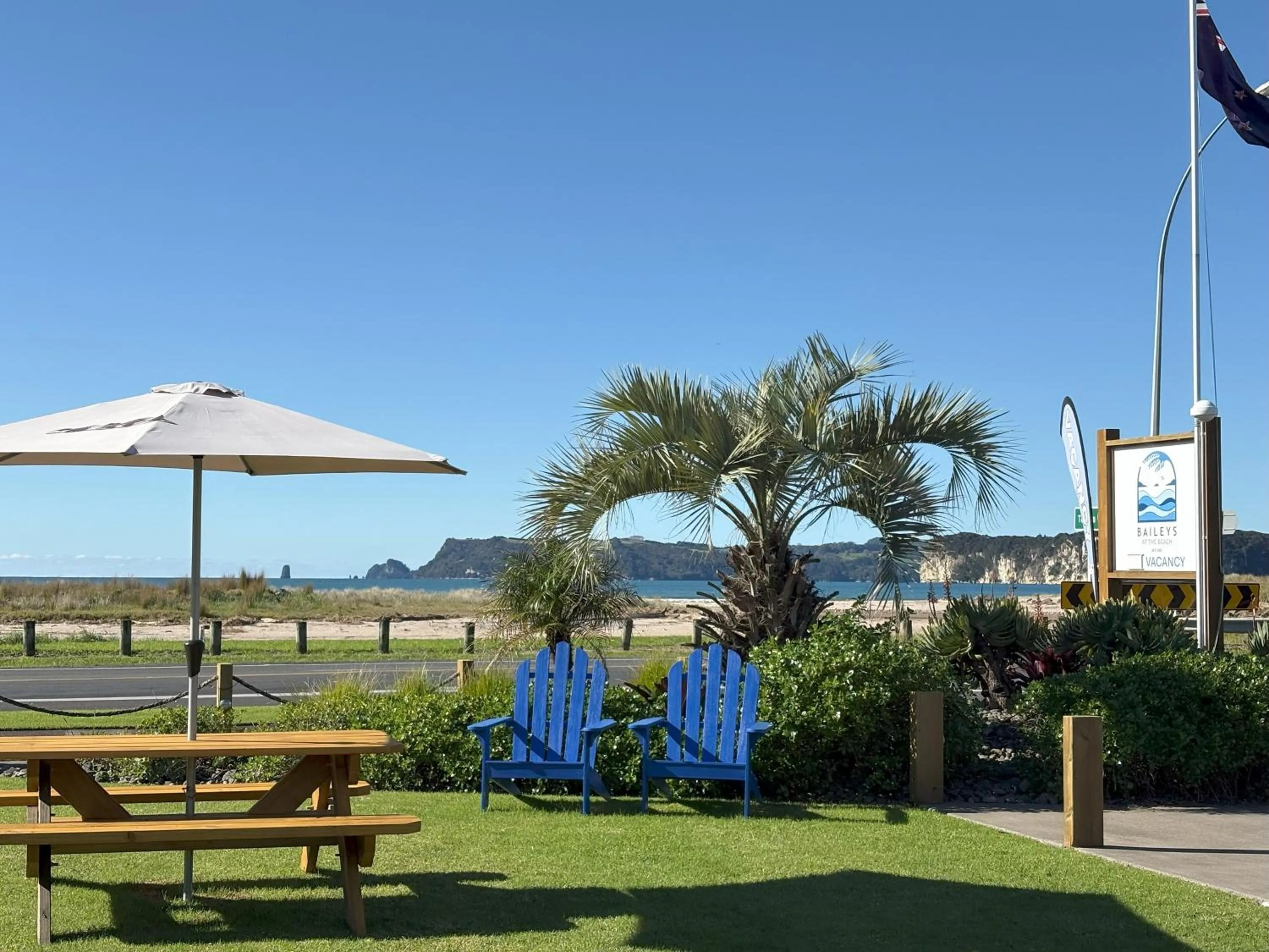 Property logo or sign in Baileys At The Beach