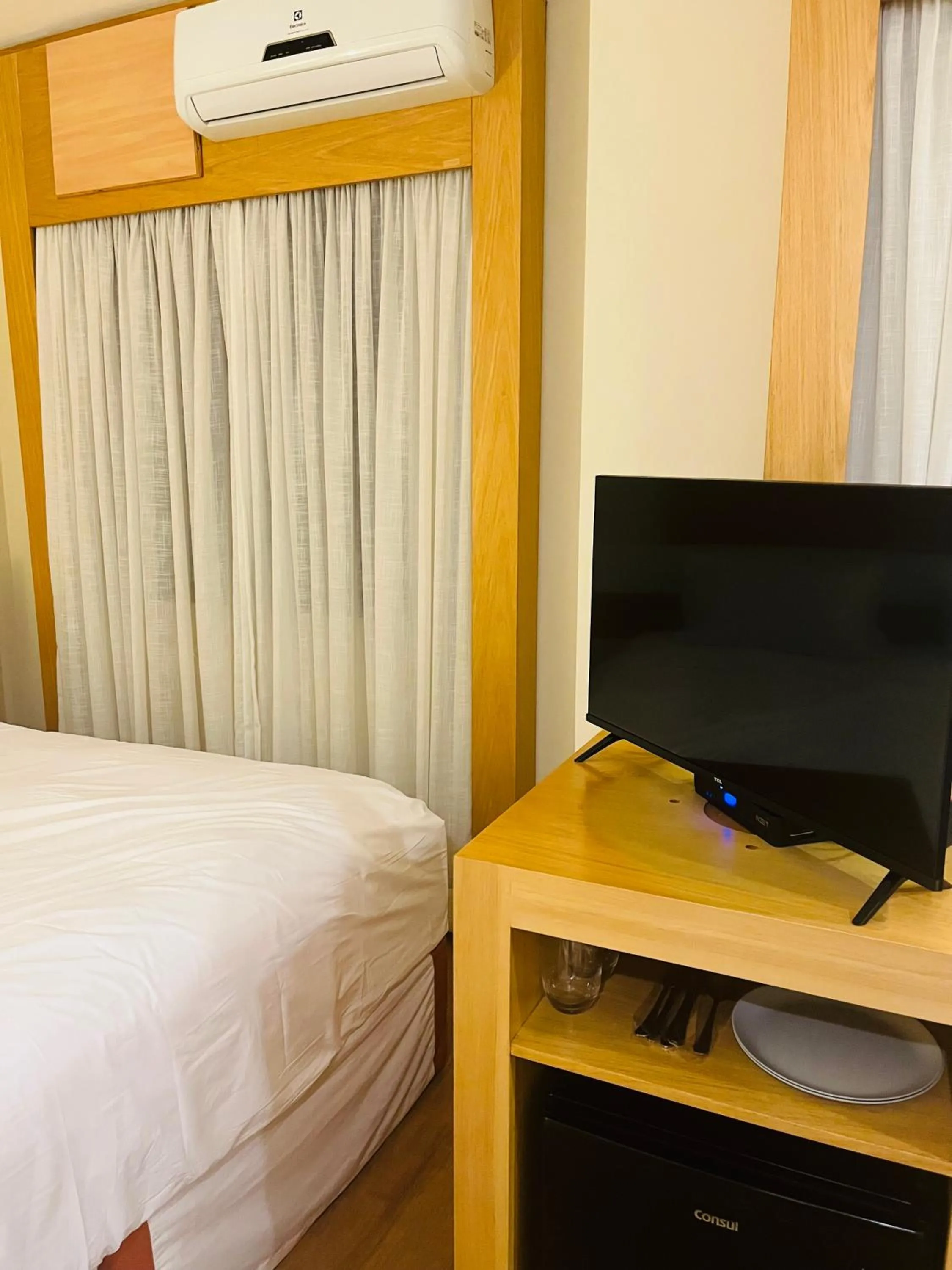 Communal lounge/ TV room, Bed in Quarto de hotel de luxo Congonhas