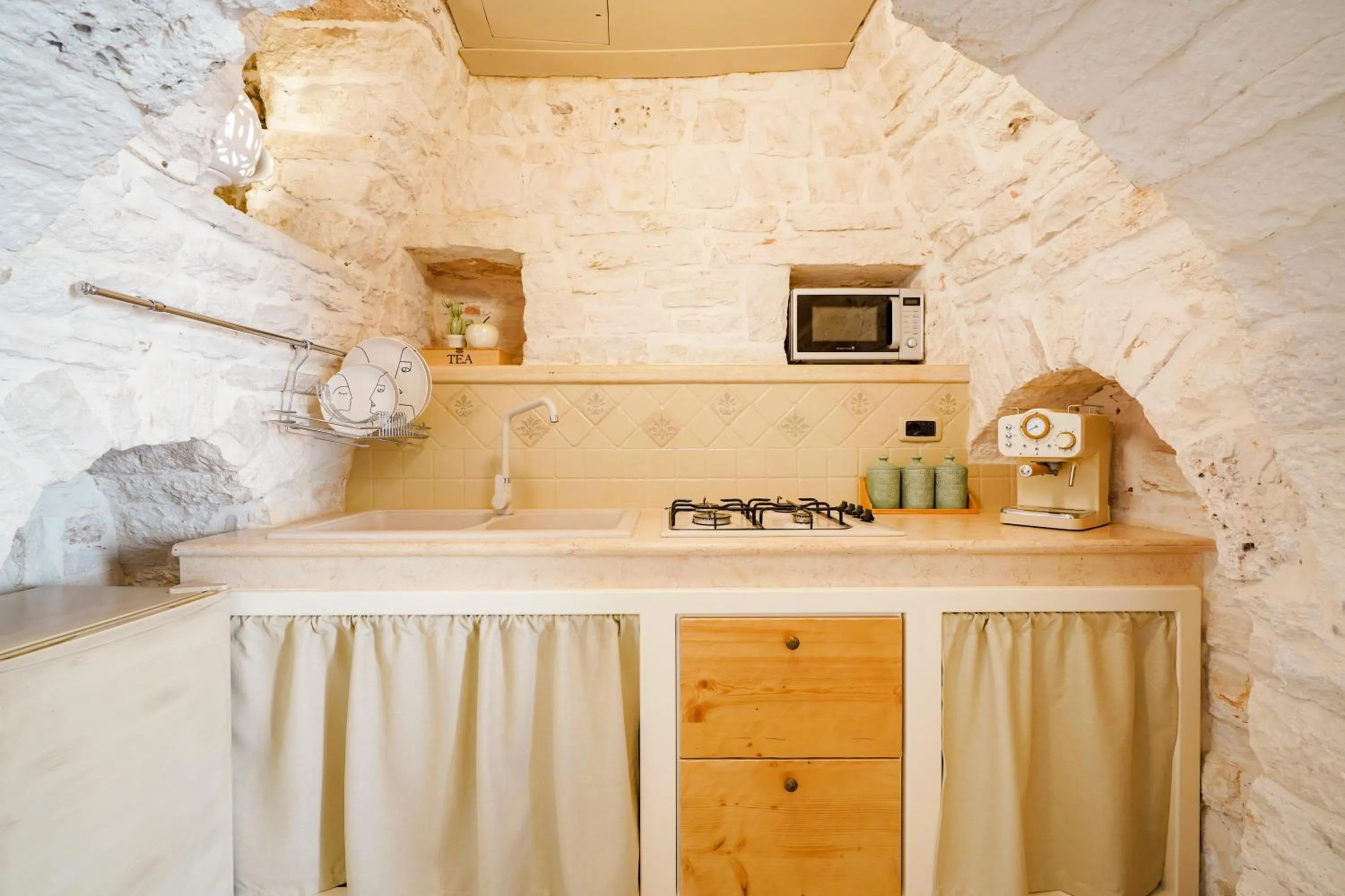 Kitchen or kitchenette in Trulli di Zia Vittoria