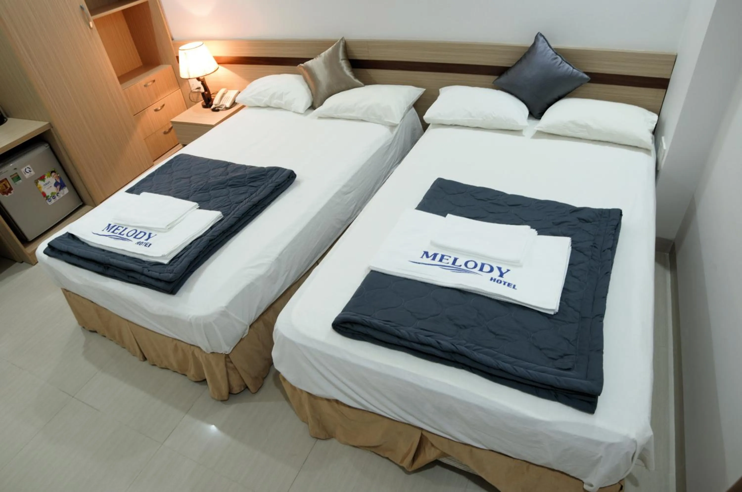 Bed in Melody Hotel
